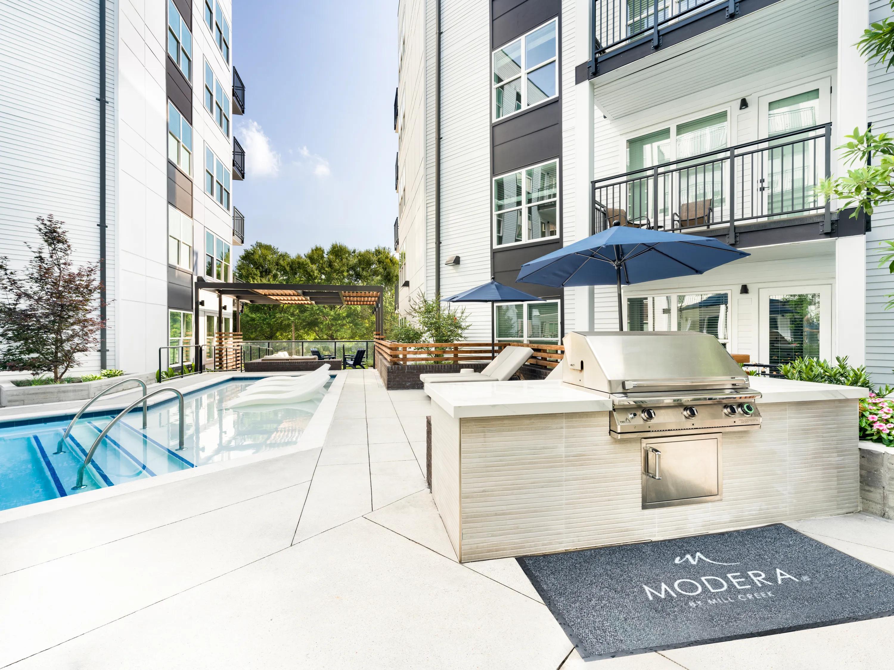 Poolside grilling station with shaded seating modera westside trail apartment homes for rent in atlanta ga