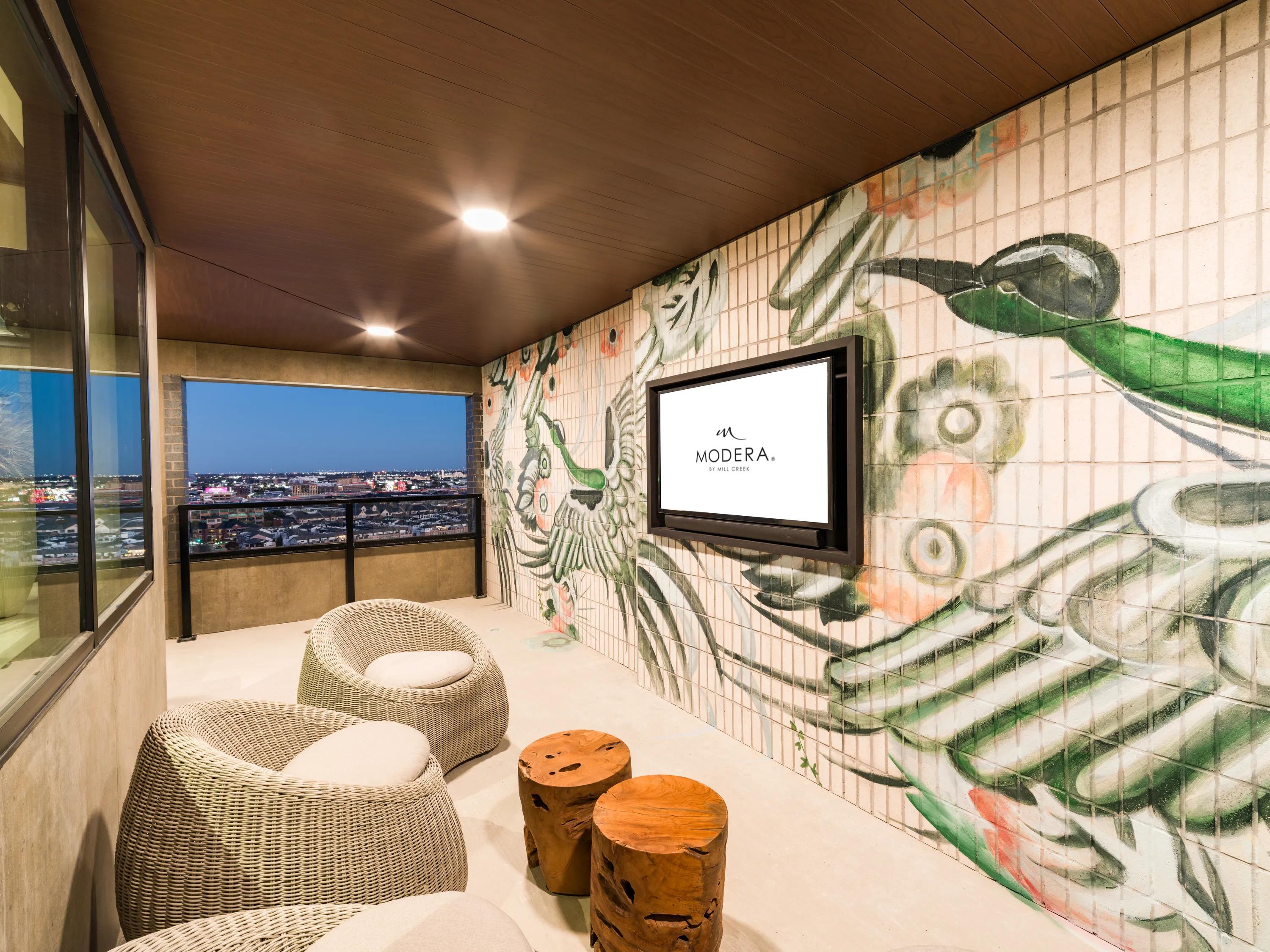 indoor outdoor lounge with tv and city views modera st paul apartment homes for rent