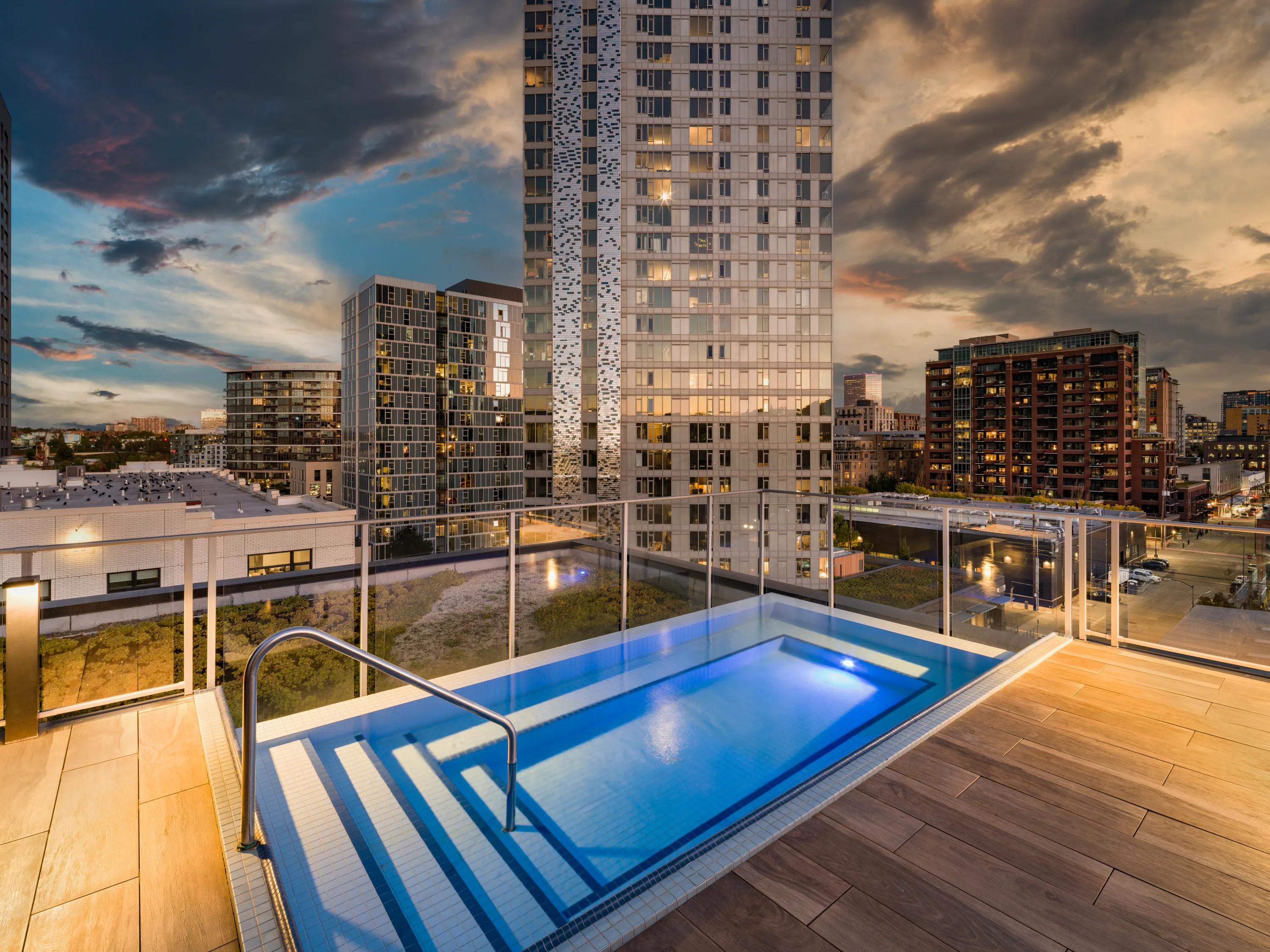 Rooftop pool with infinity spa at dusk modera pearl portland or apartments