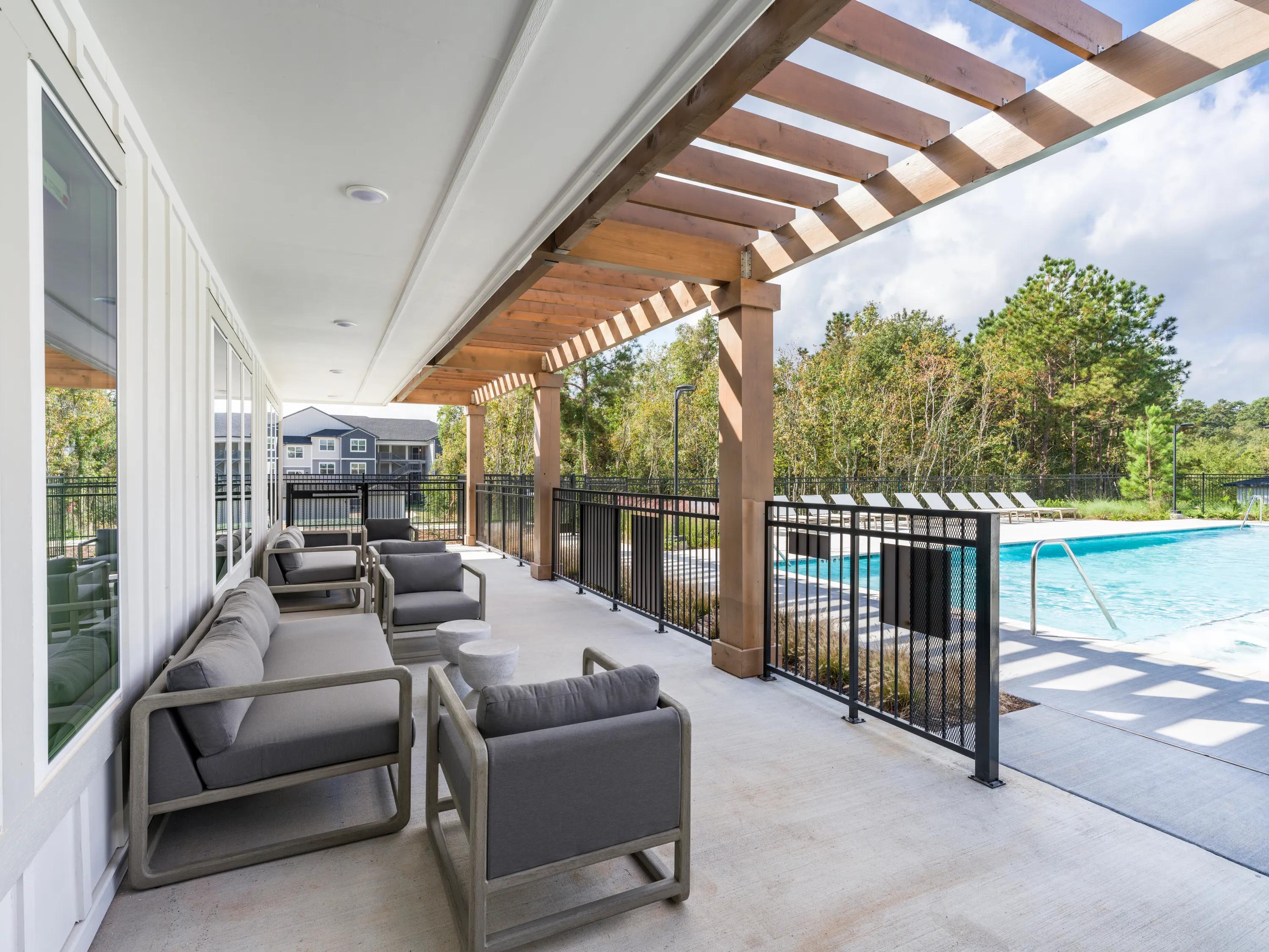 outdoor pool with sundeck loungers beckett west fork apartment homes for rent in conroe tx
