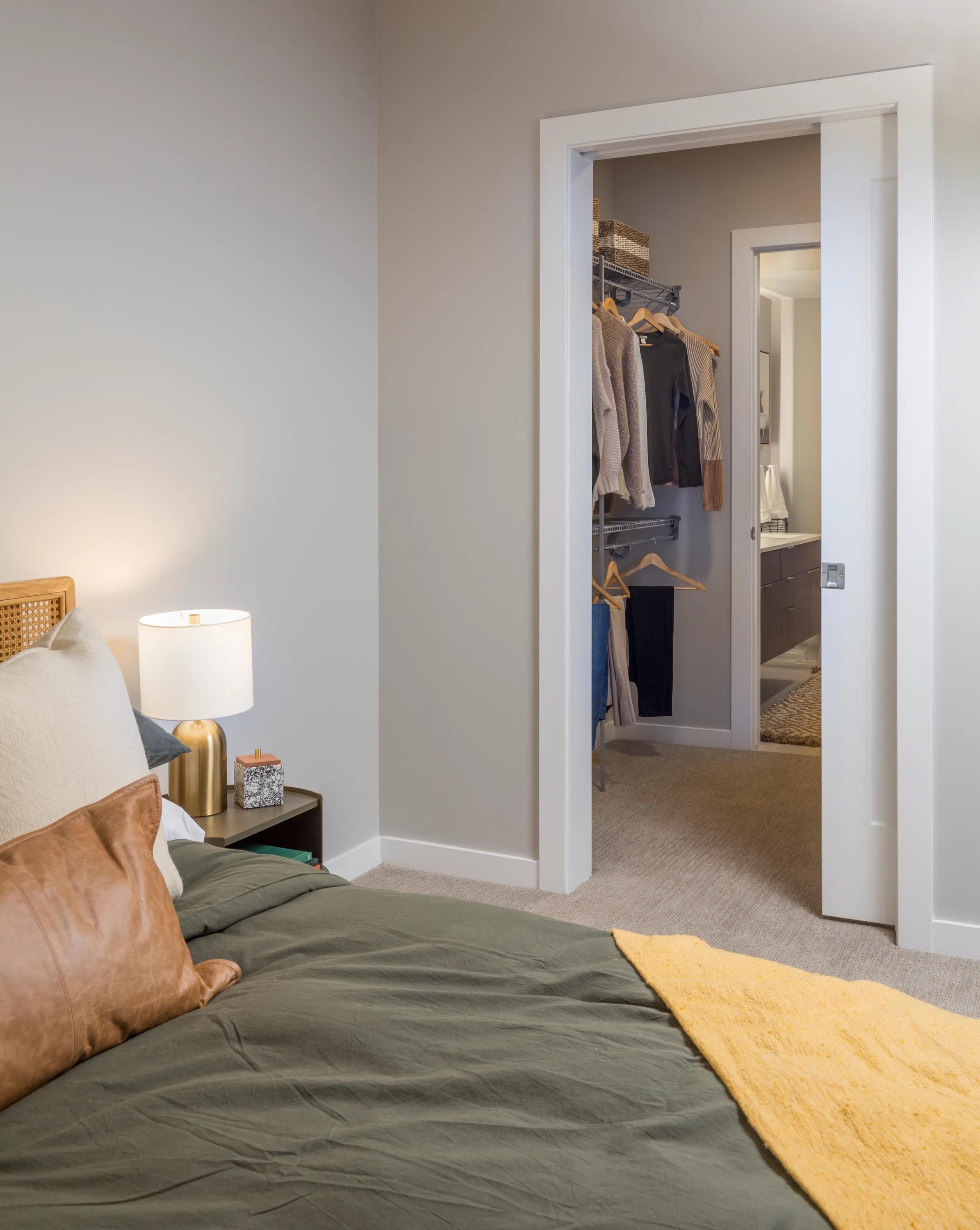 View of bedroom and pass through closet modera lohi apartments in denver co