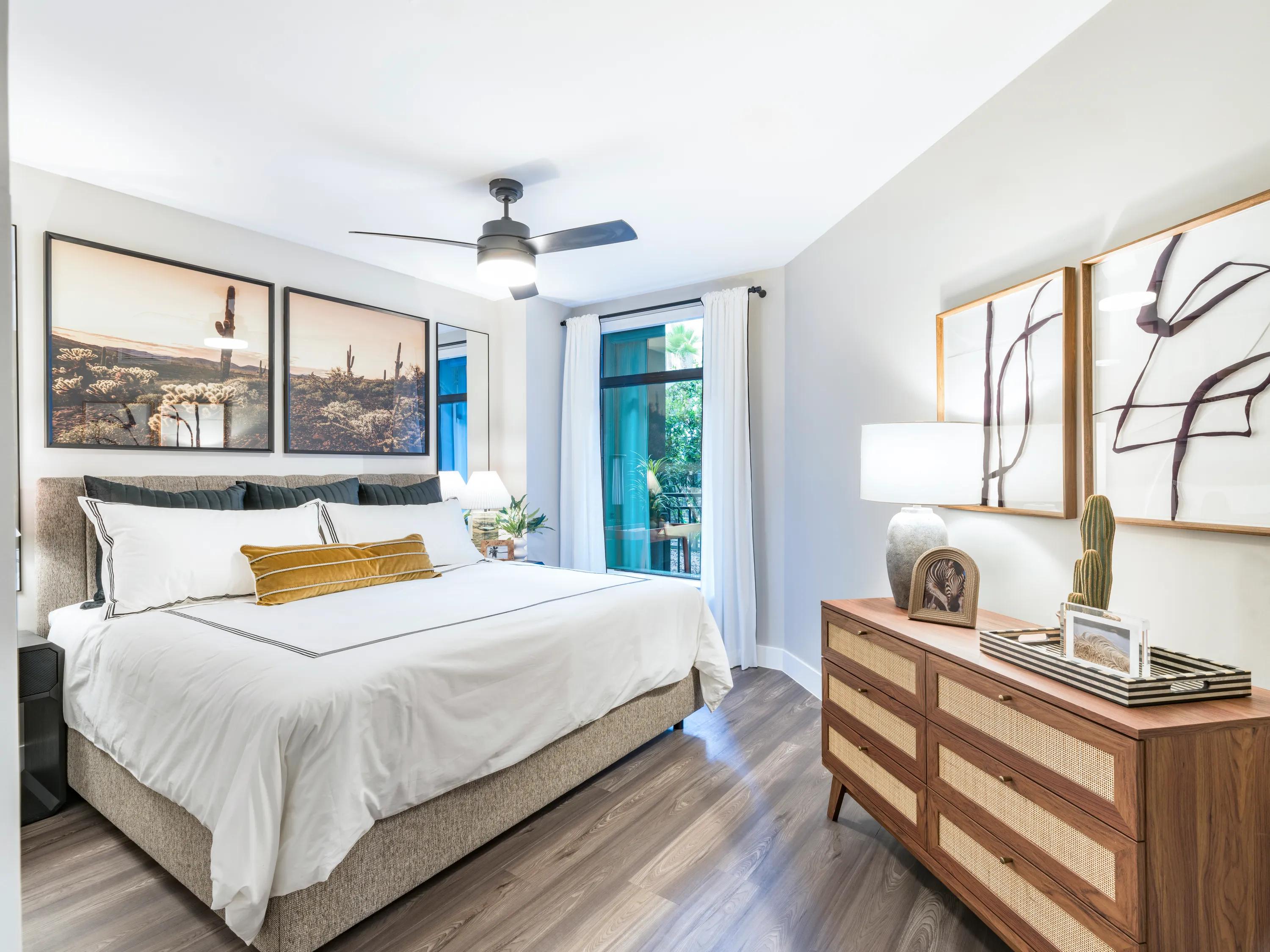 large bedroom with corner window and dresser modera reserve apartment homes for rent in scottsdale az