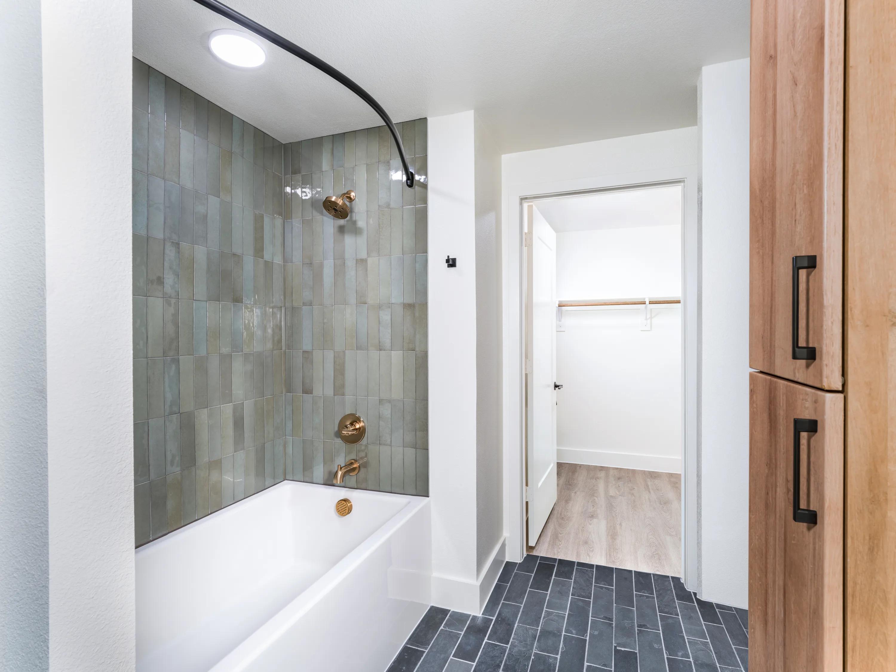 stunning bathroom with custom shower and vanity modera st paul apartments in dallas tx