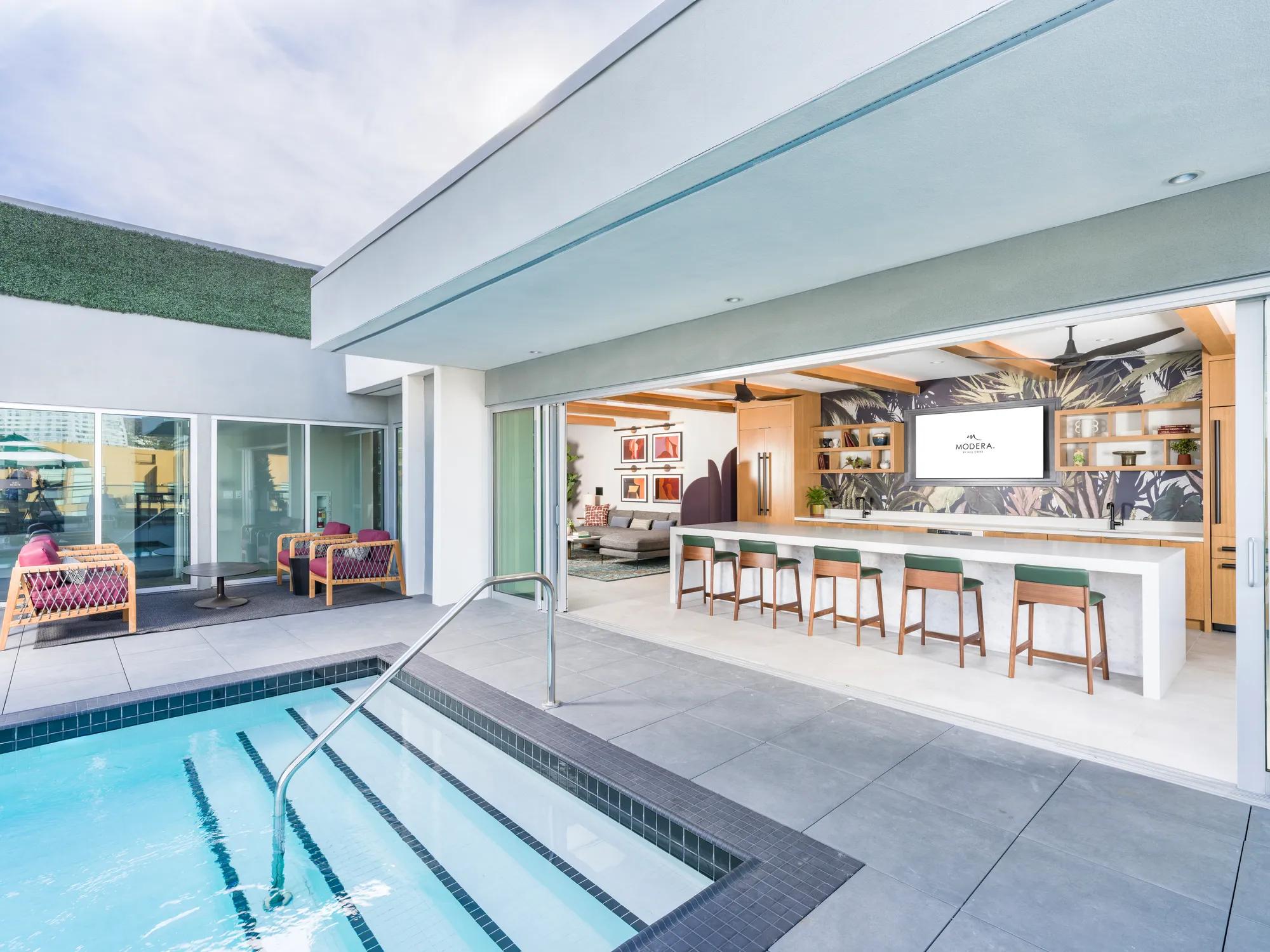 rooftop pool with outdoor bar modera argyle apartments for rent in los angeles ca