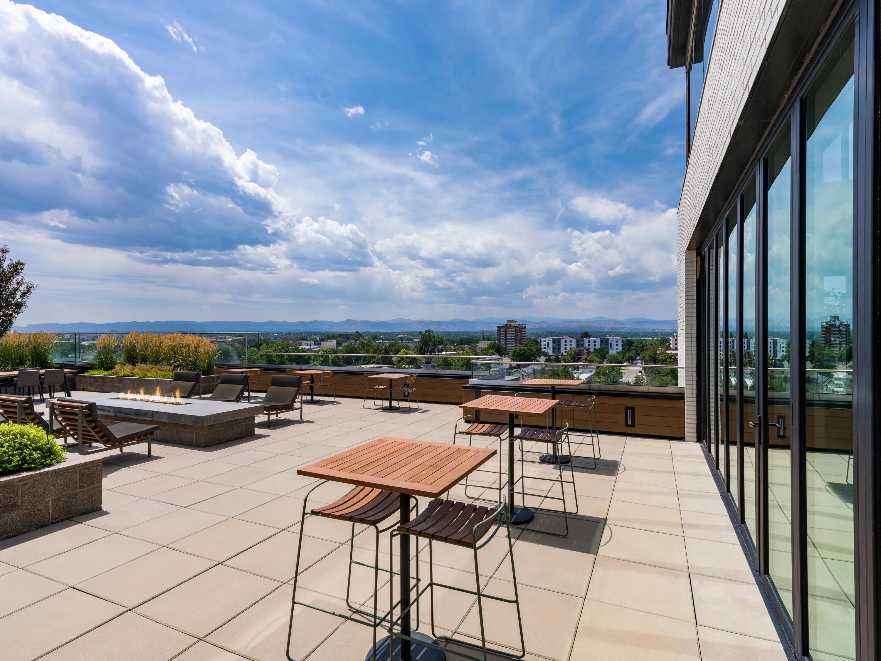 Chic rooftop terrace with modern outdoor furniture offering panoramic view