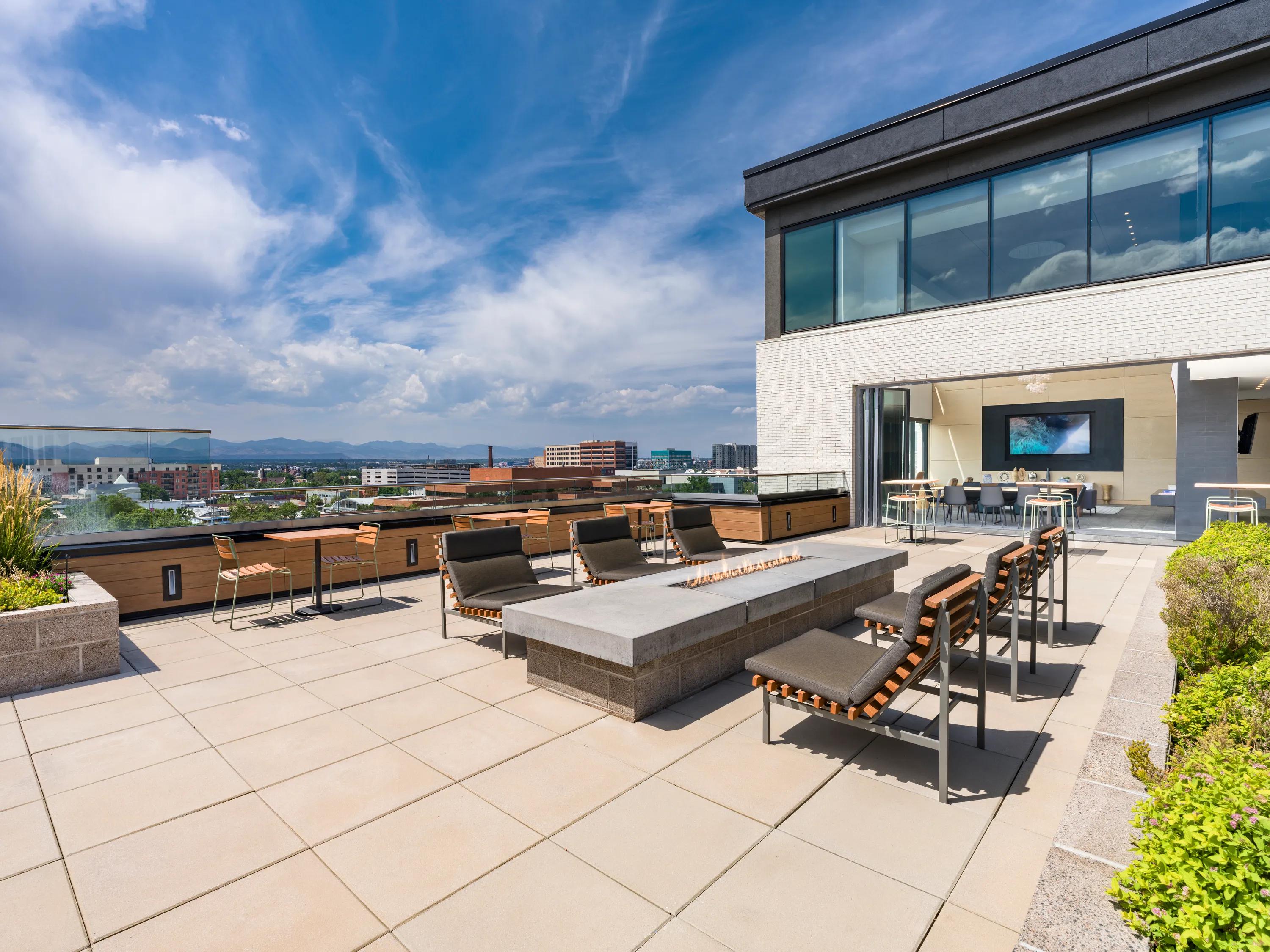 Outdoor TV lounge with firepits modera west wash park