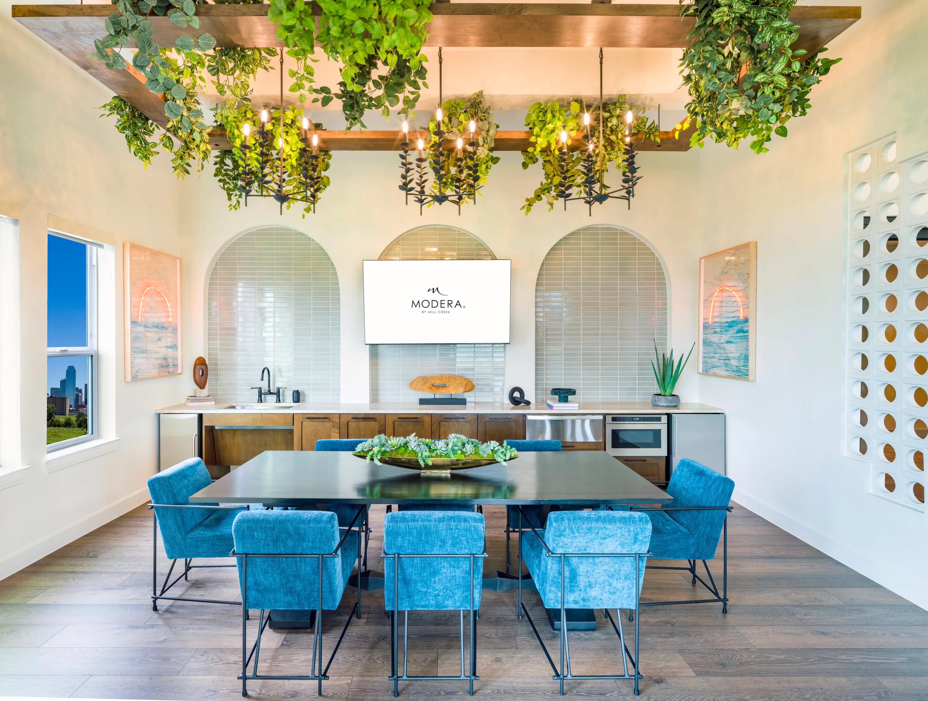 clubhouse with seating and demonstration kitchen modera trinity apartment homes for rent in dallas texas