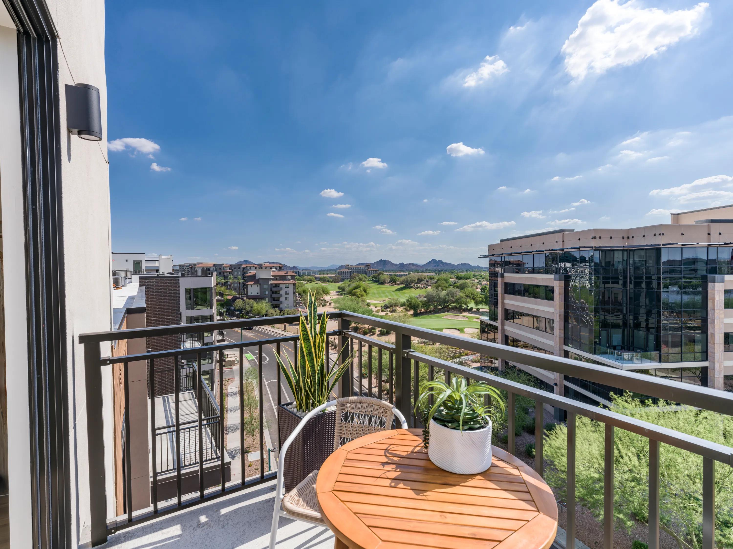 balcony with golf course view on sunny day modera reserve apartment homes for rent in scottsdale az