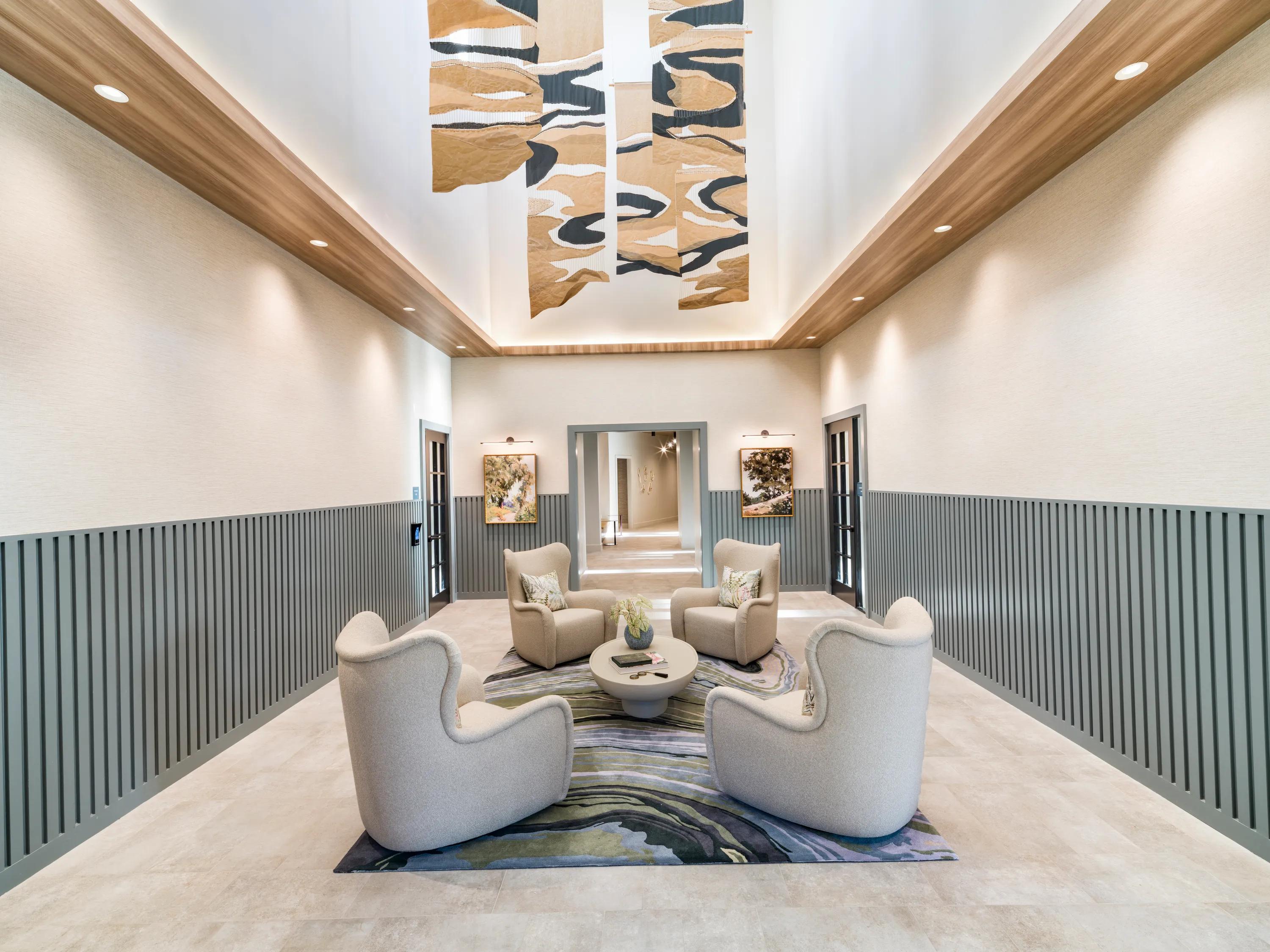 lounge seating area with high ceilings modera south shore apartment homes for rent in marshfield ma