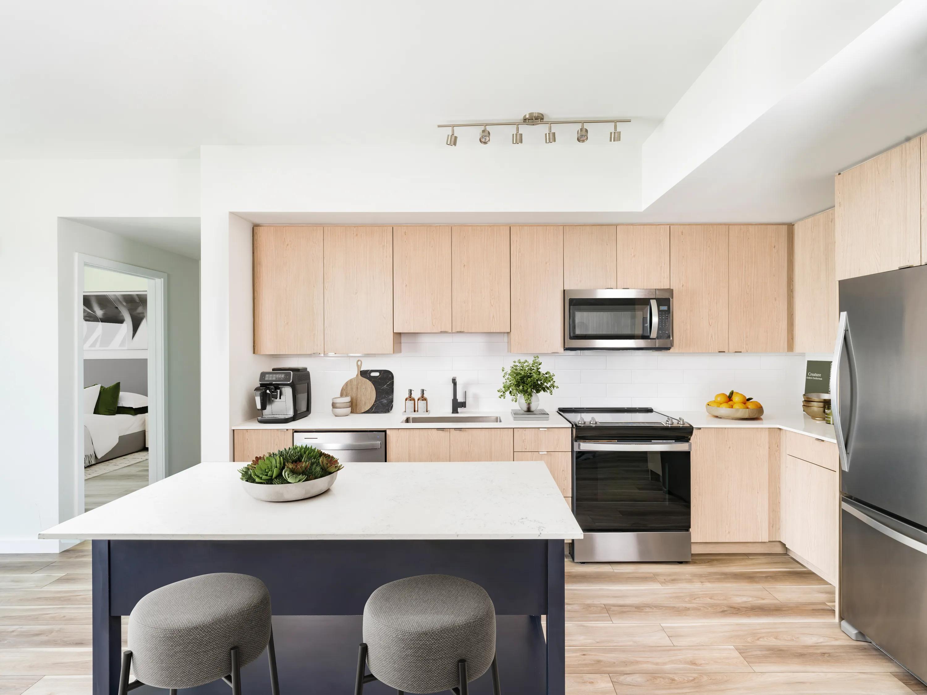 Kitchen with stainless steel appliances and soft close cabinets modera aventura apartments for rent miami fl
