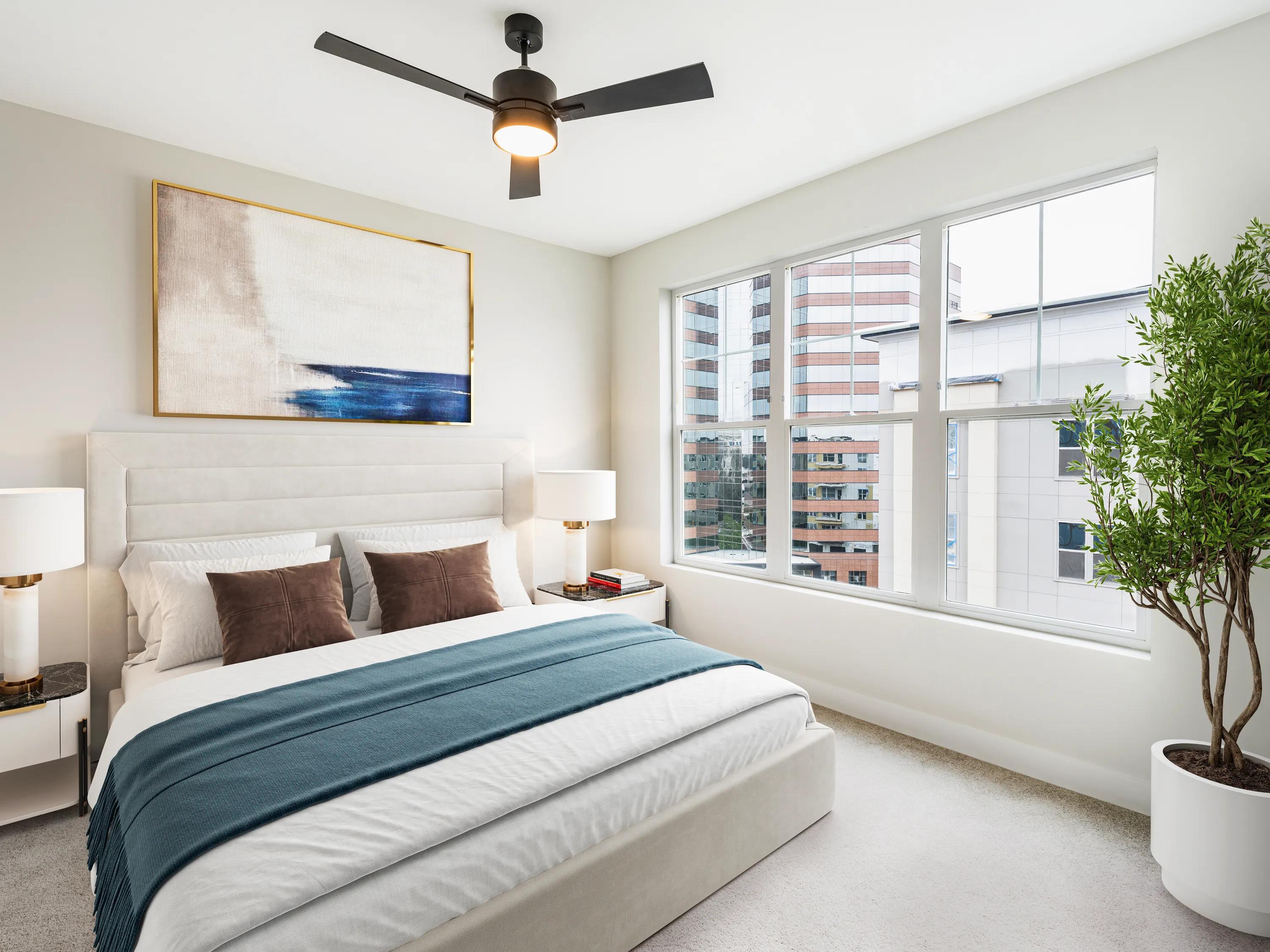 bedroom with large windows and ceiling fan modera liberty row apartment homes for rent in in charlotte nc