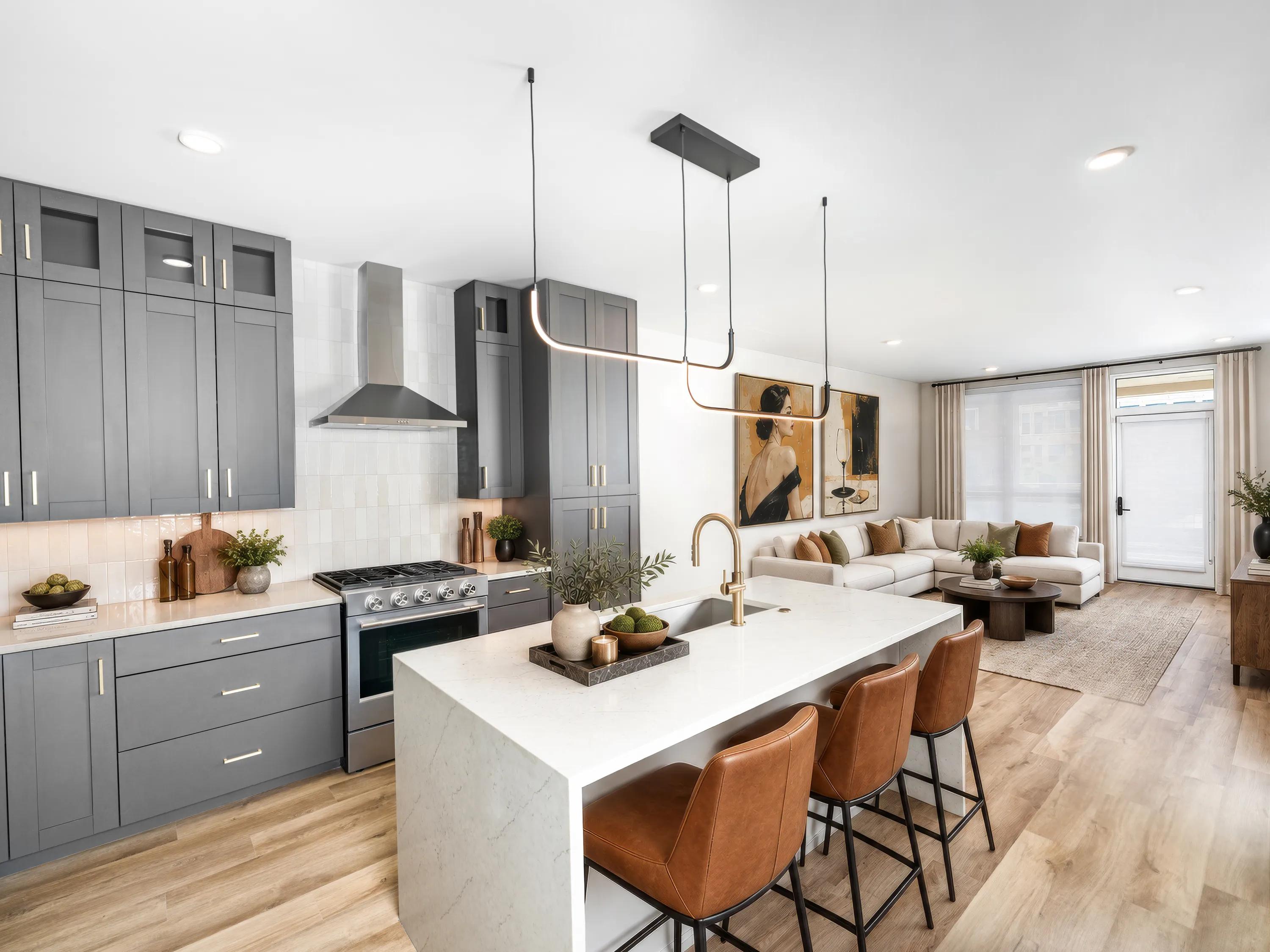 Gourmet kitchens with quartz countertops, 42-inch custom cabinetry with soft close, and under-cabinet lighting