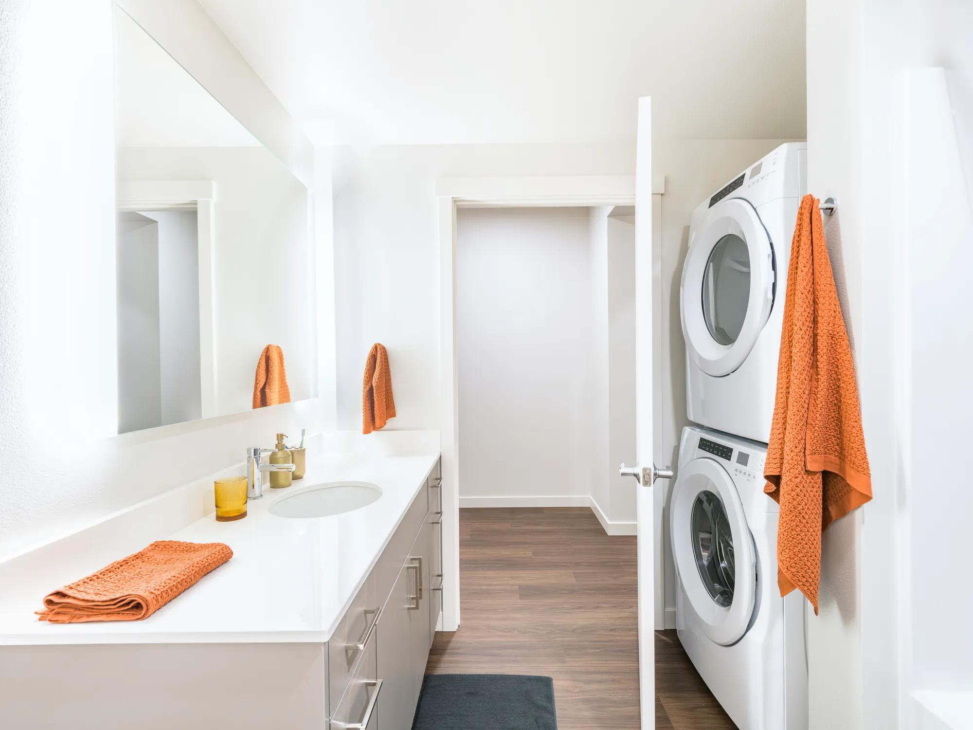 full size washer and dryer in modern bathroom space