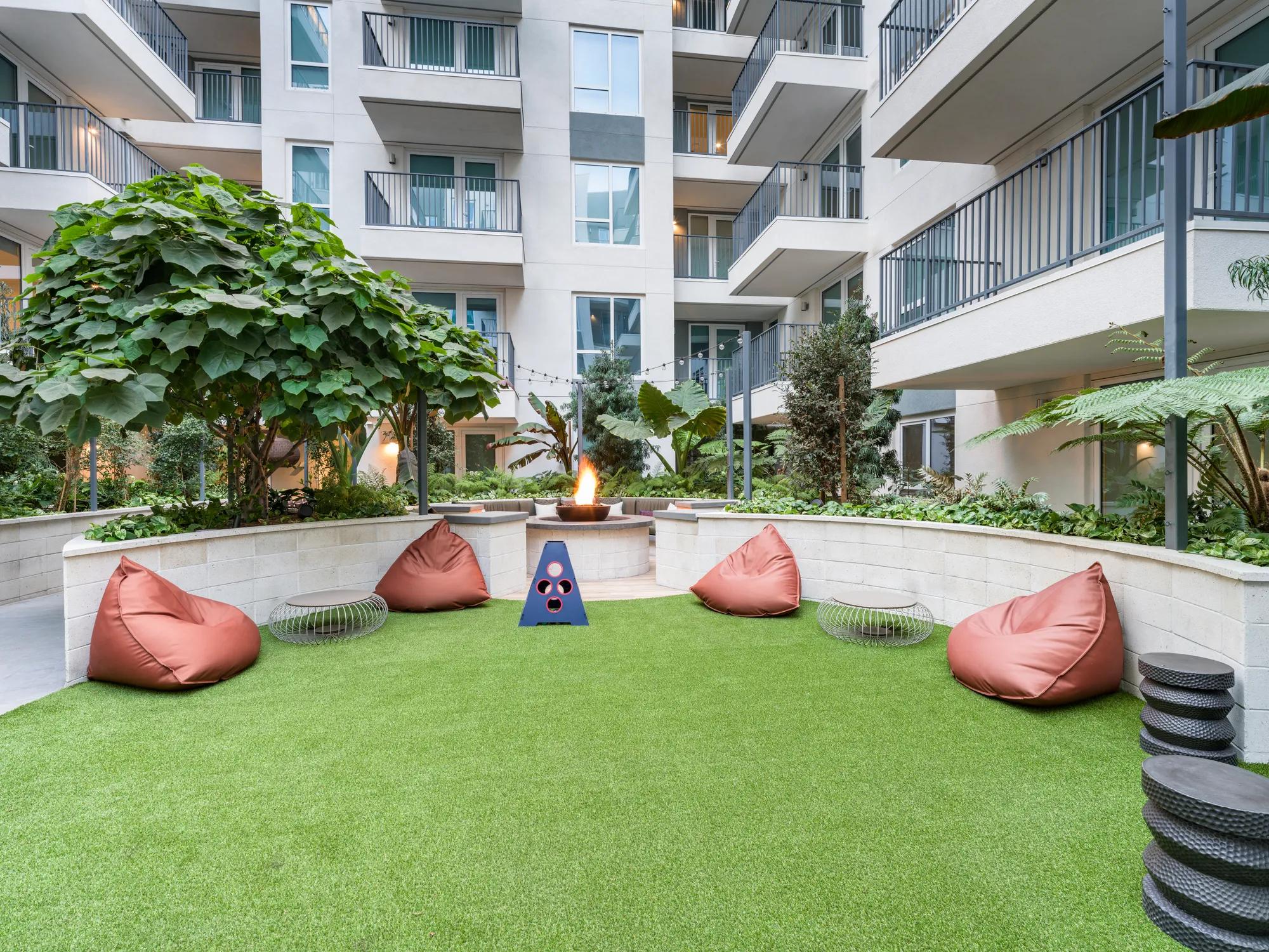 community lounge with outdoor courtyard and gaming area