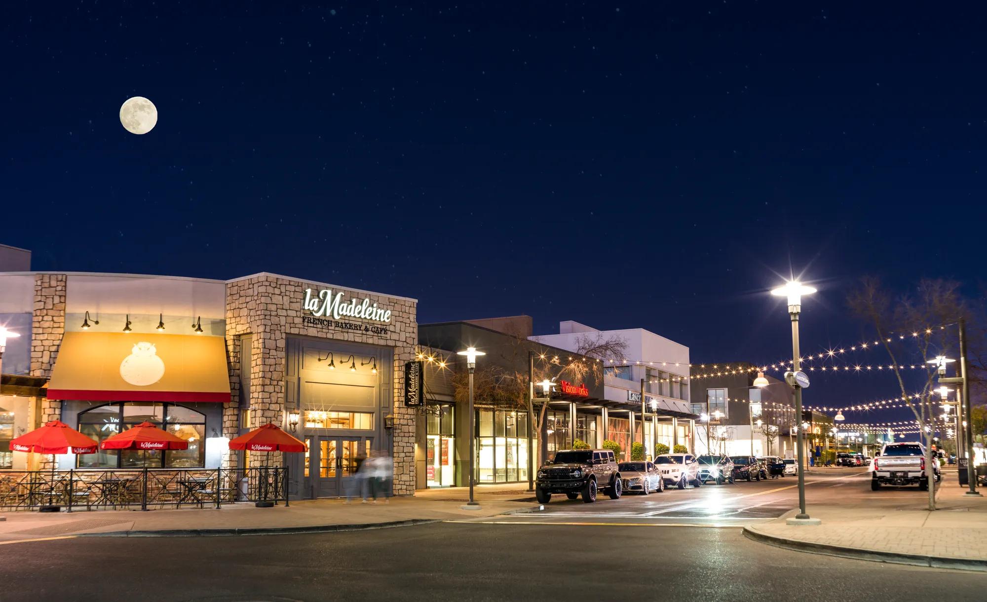 santan village with stores and restaurants lining building at modera higley commons apartment homes for rent in gilbert az