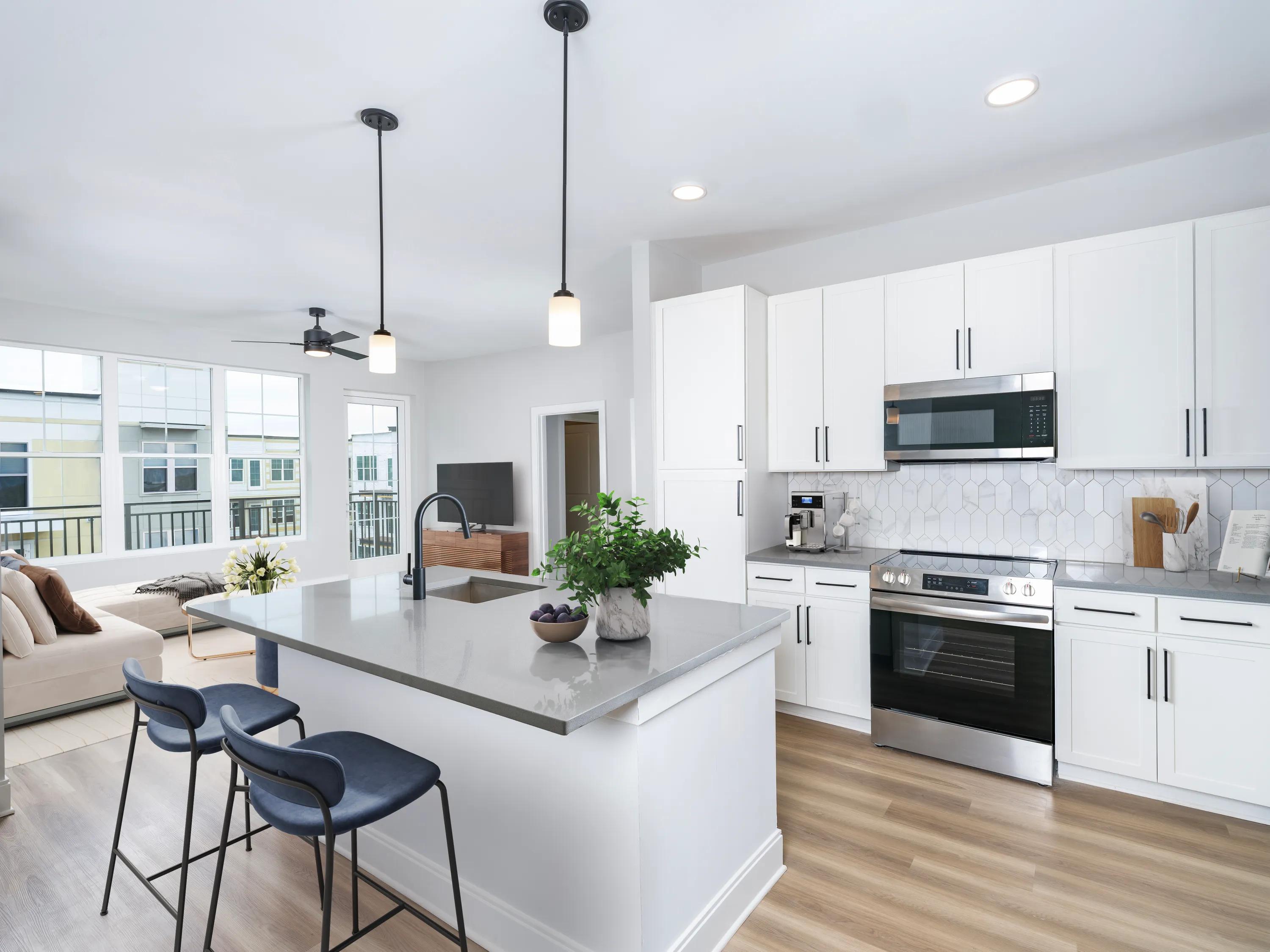 kitchen with large island and stainless steel appliances modera liberty row apartment homes for rent in in charlotte nc