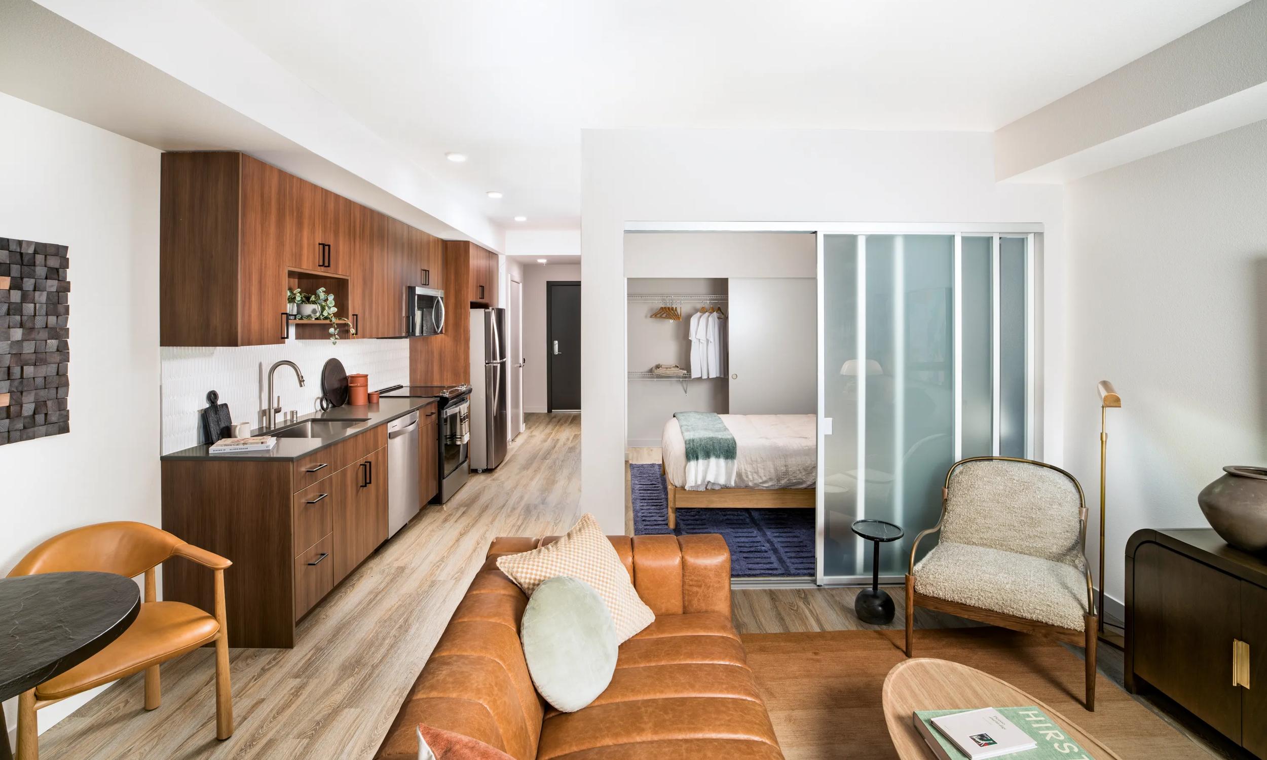 modera shoreline apartments in shoreline wa near seattle community interior studio with kitchen and living room view