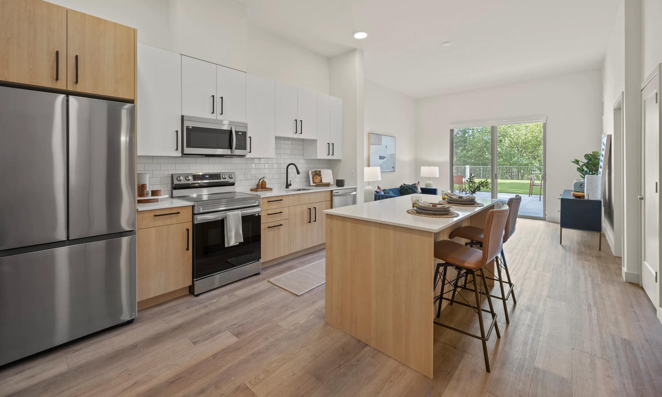 interior kitchen with hardwood style flooring modera newton apartments in newton ma