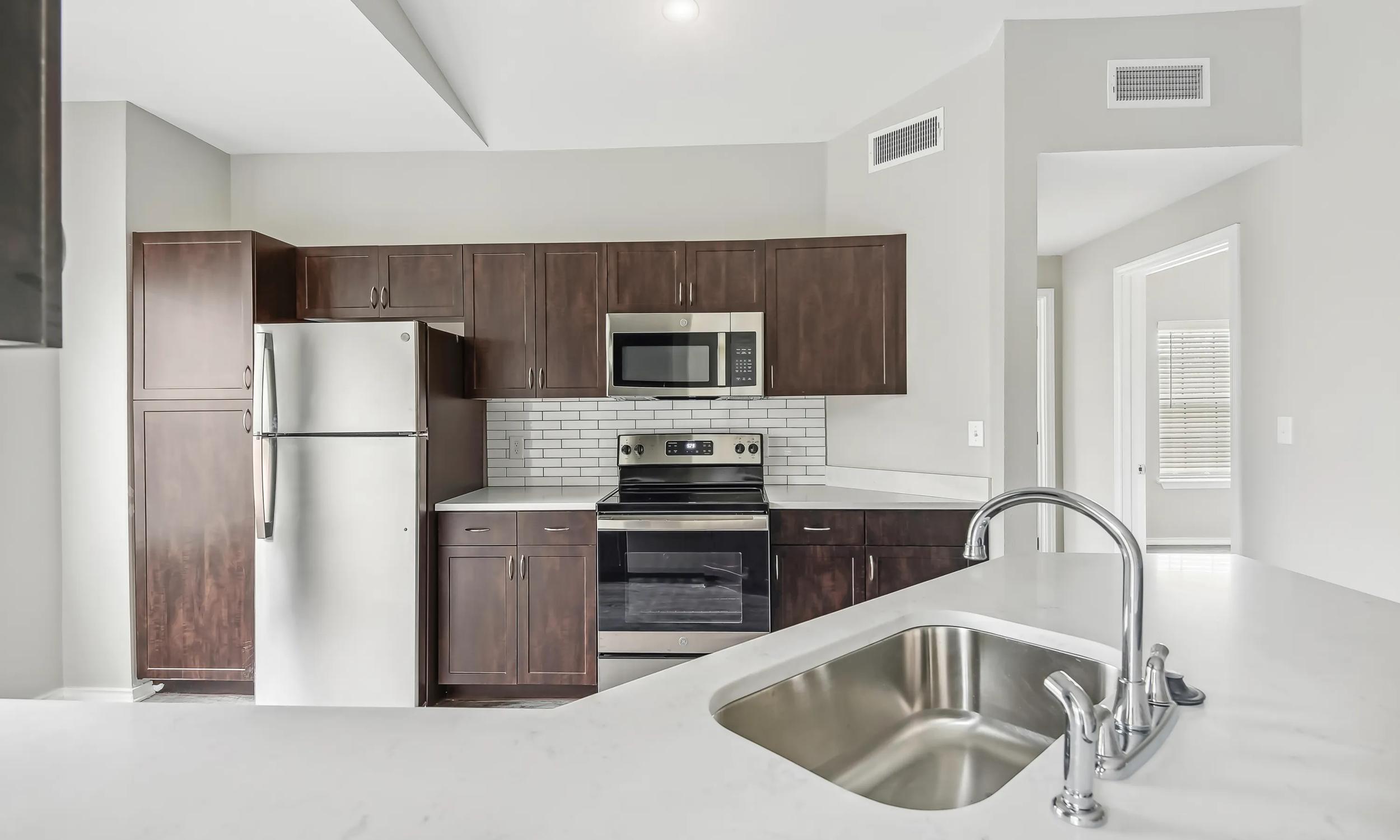 alister sunset valley interior kitchen with stainless steel appliances apartments in austin tx