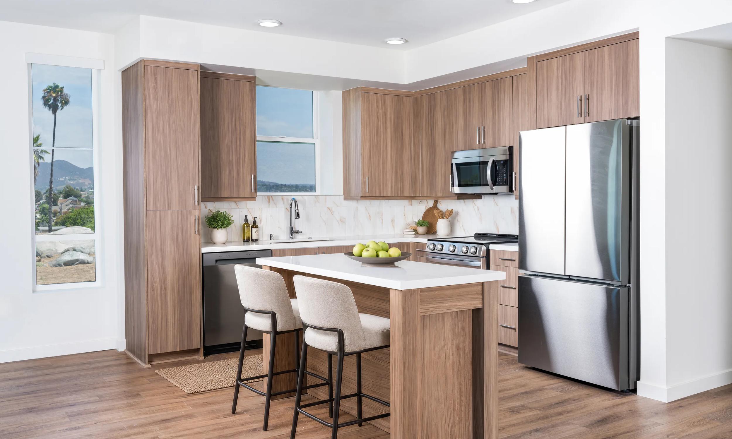 modera melrose apartments in oceanside ca bright kitchen with wood cabinetry and mountain views