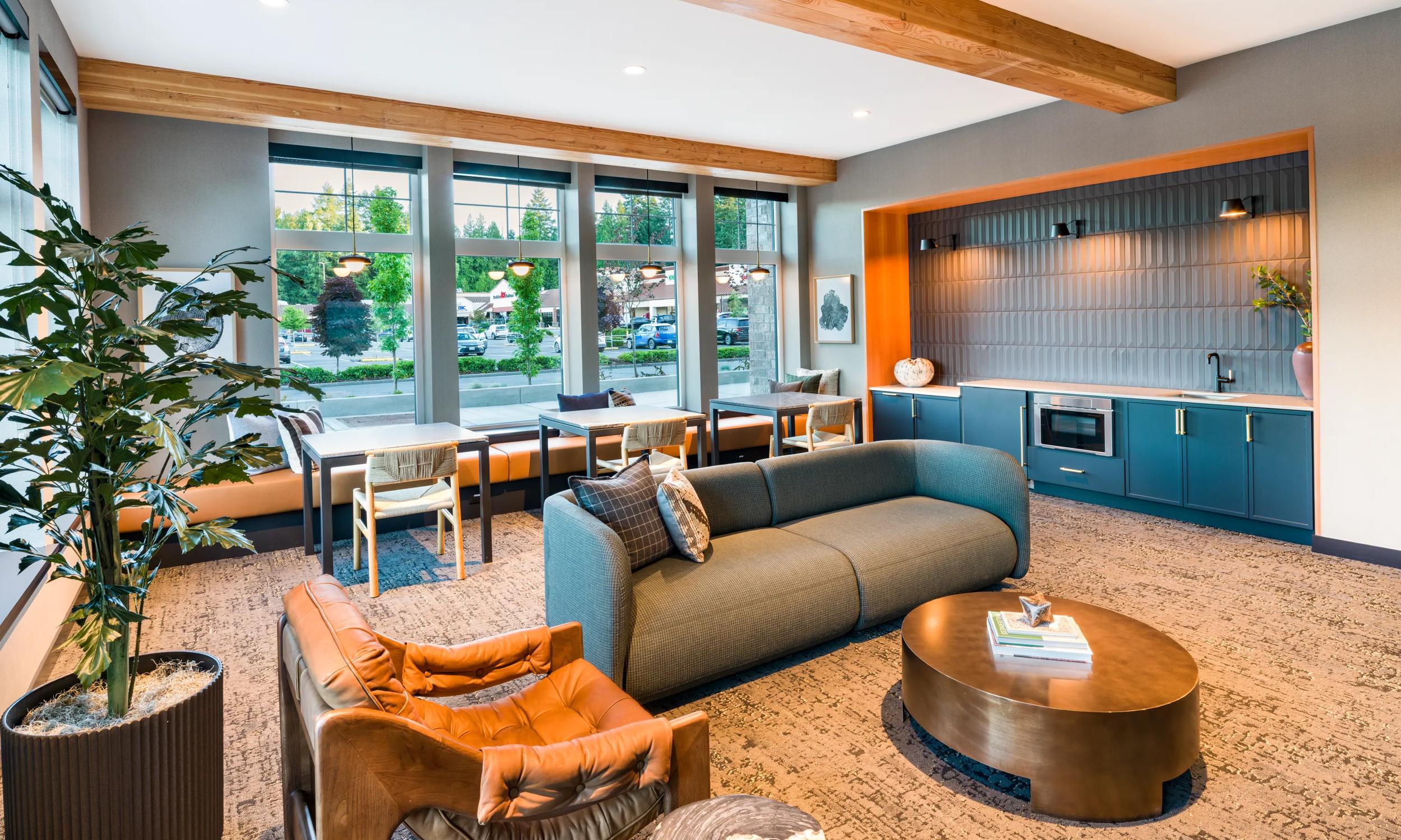 Chic modern lounge area with cozy seating, elegant decor, and large windows for natural light modera bridle trails apartments for rent in kirkland wa