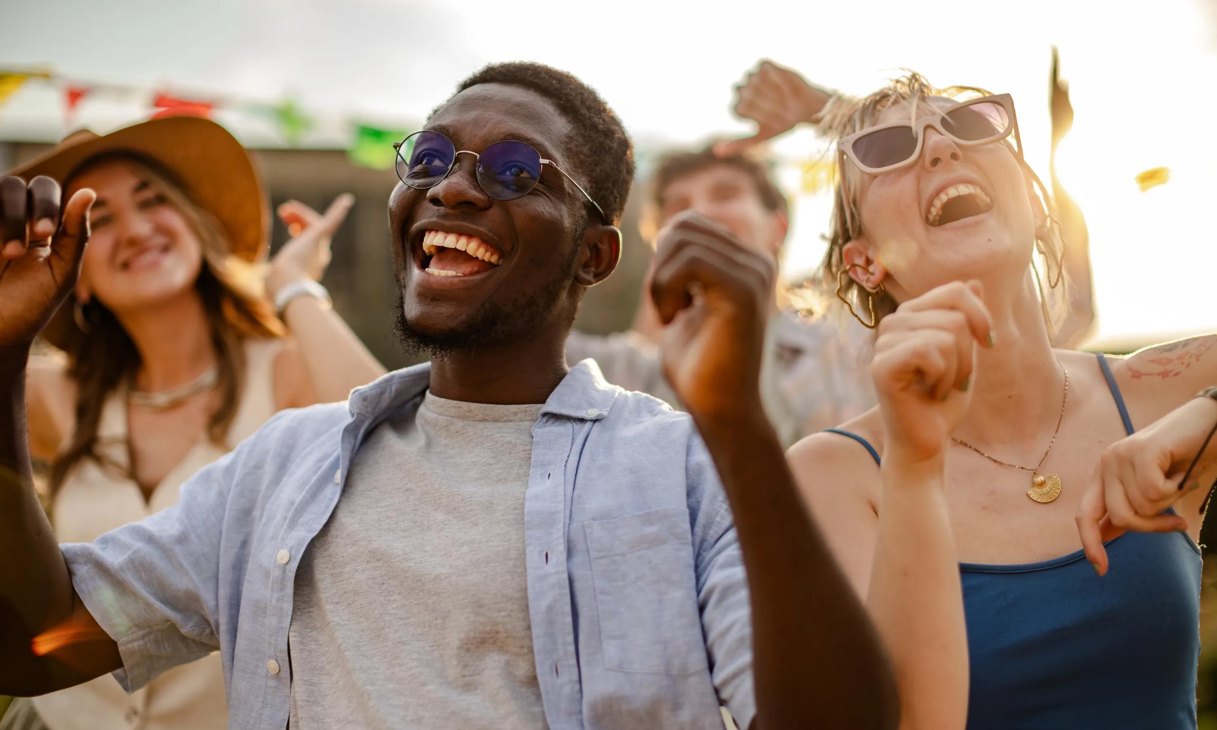 young friends enjoying live outdoor music near modera rigeline apartments in mkcinney tx