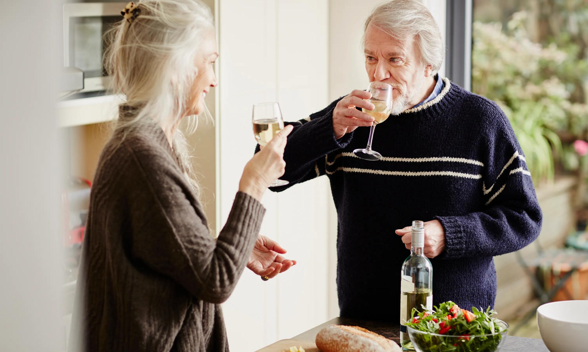 mature couple enjoying a glass of wine modera rigeline apartments in mkcinney tx