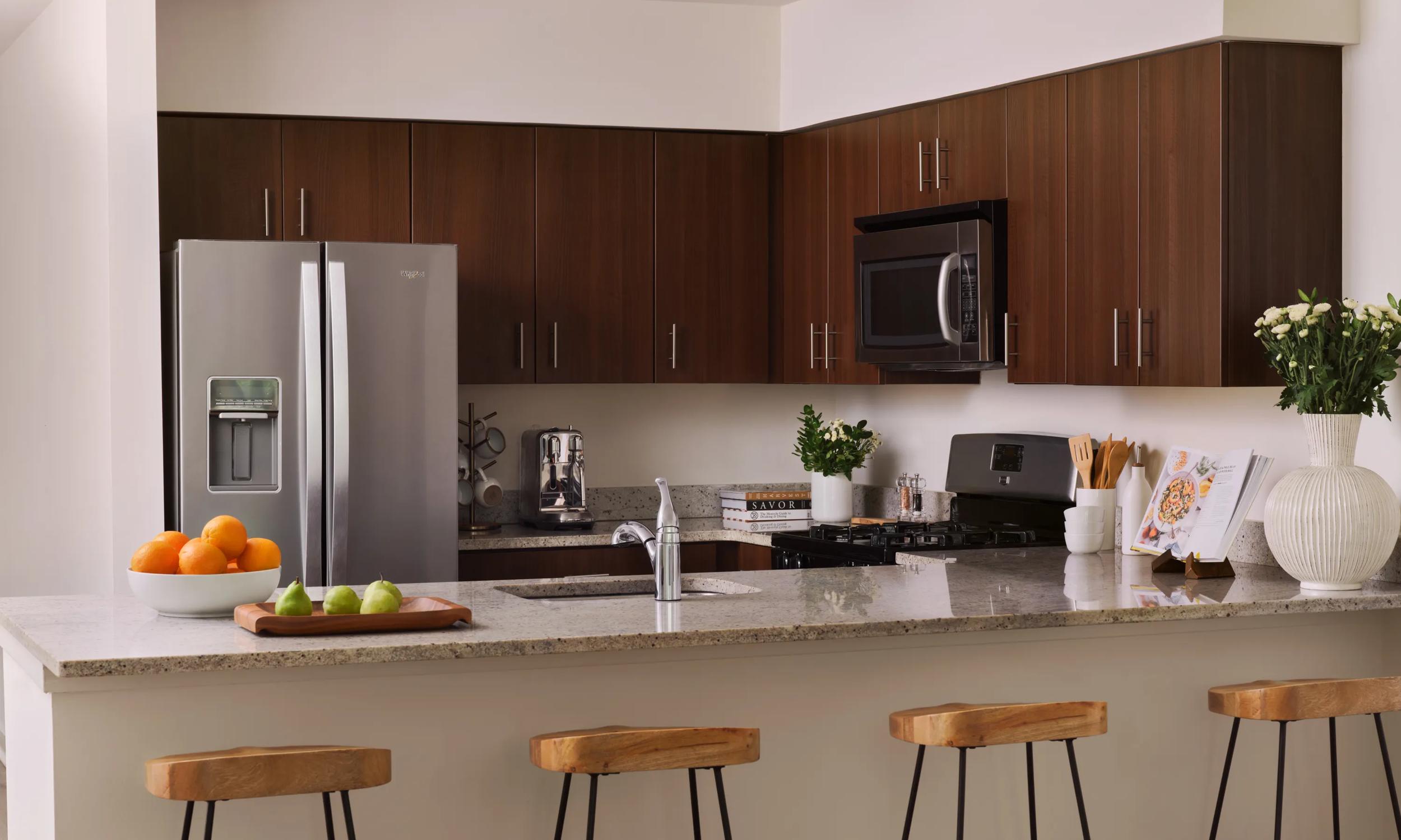 interior kitchen with two toned cabinetry and stainless appliances the metropolitan at 40 park morristown nj apartments for rent