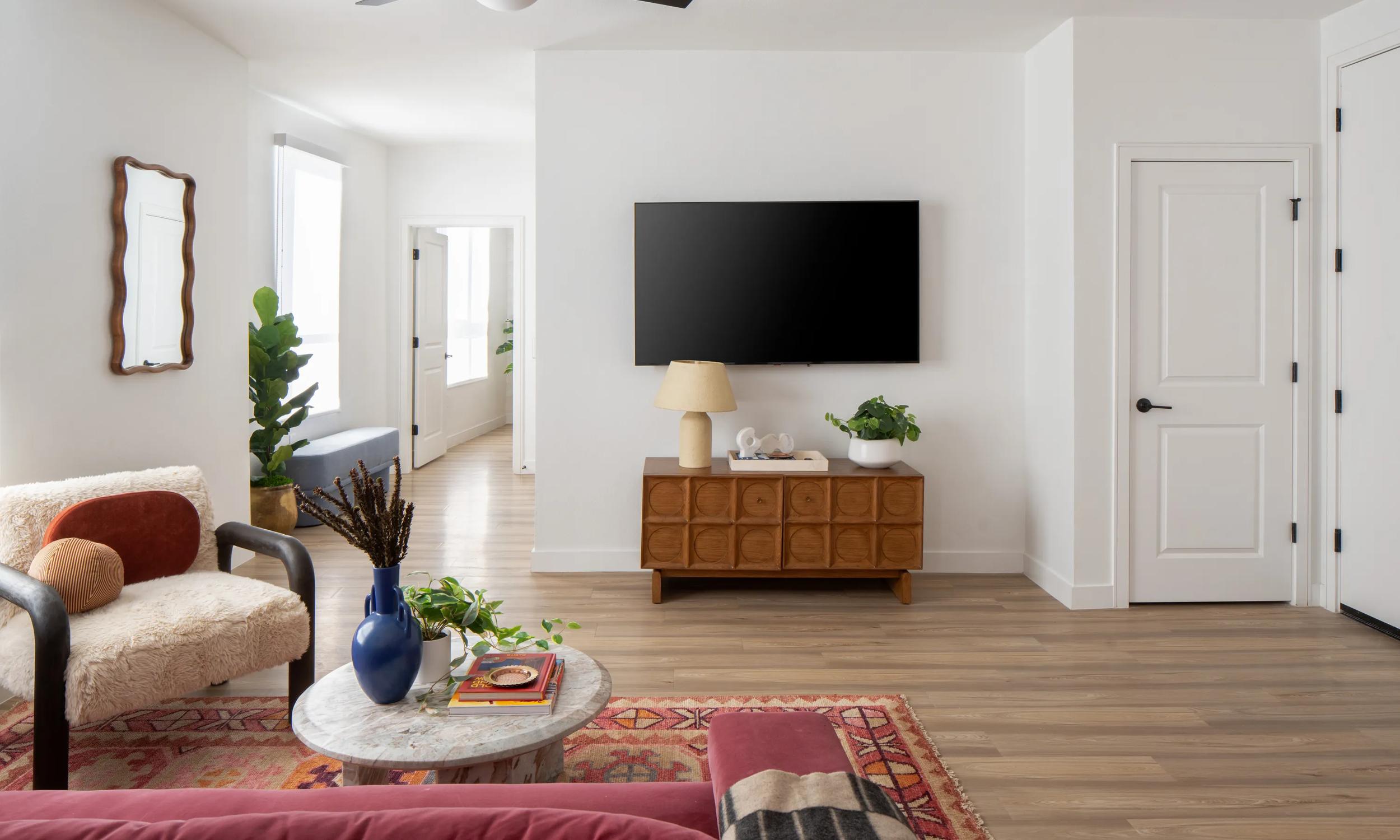 living area with wood accents and ceiling fans modera rio salado apartment homes for rent in tempe az