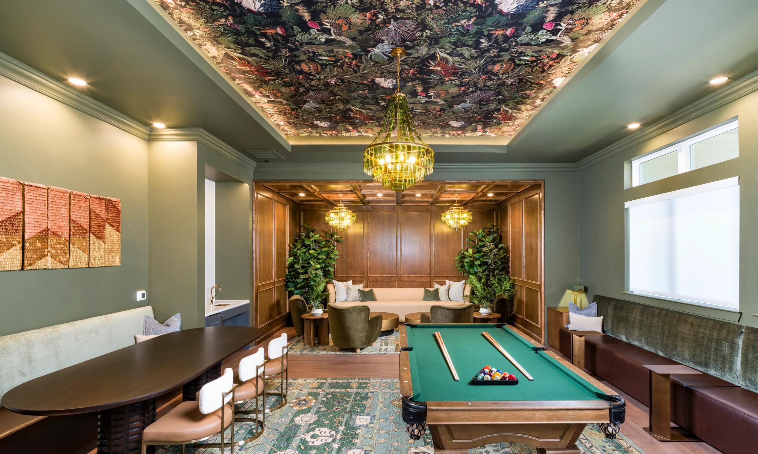 The Parlor features a billiards table, shared seating, and rich finishes set beneath a patterned ceiling and statement lighting modera walsh heights