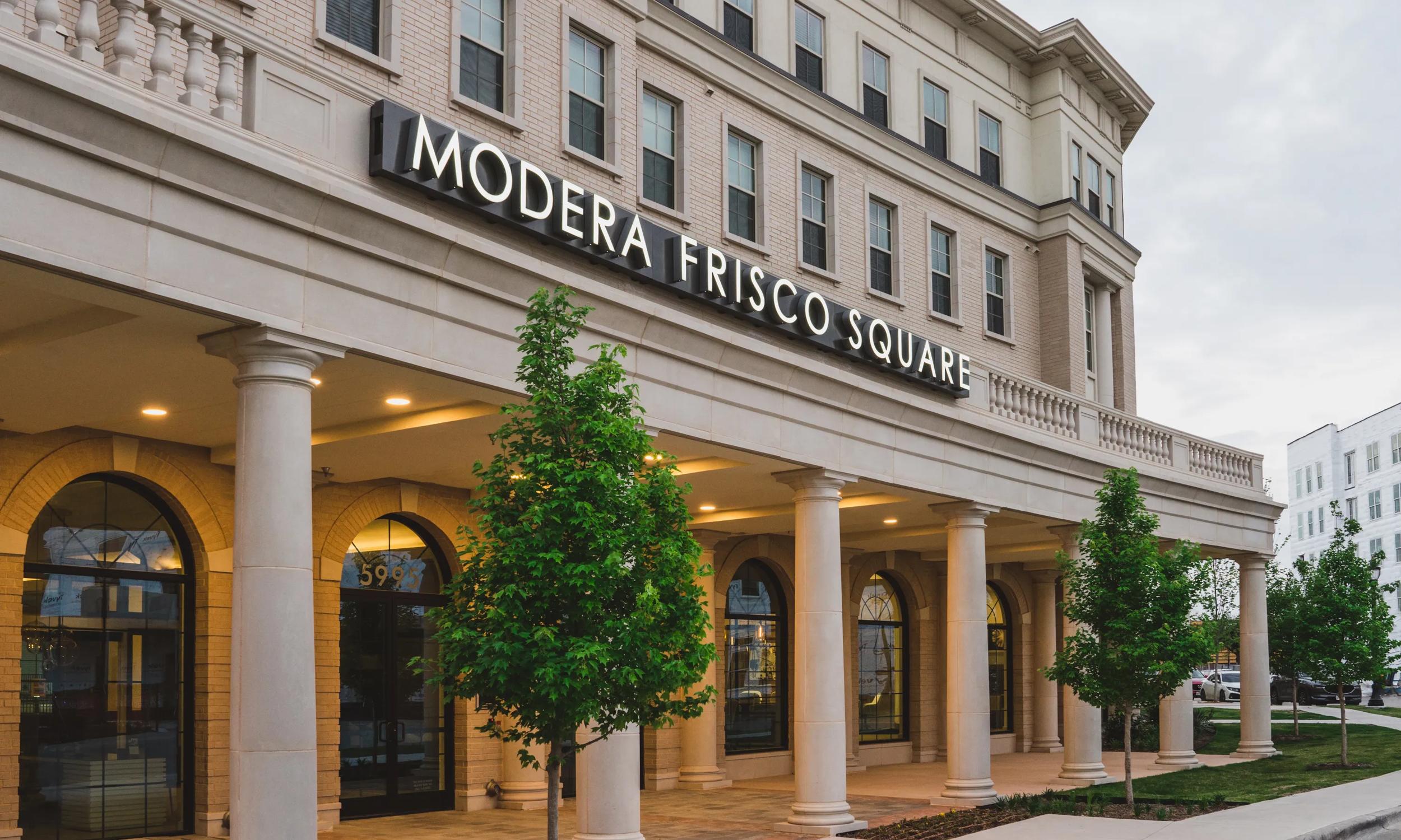 exterior building with community name signage modera frisco square apartments in frisco tx