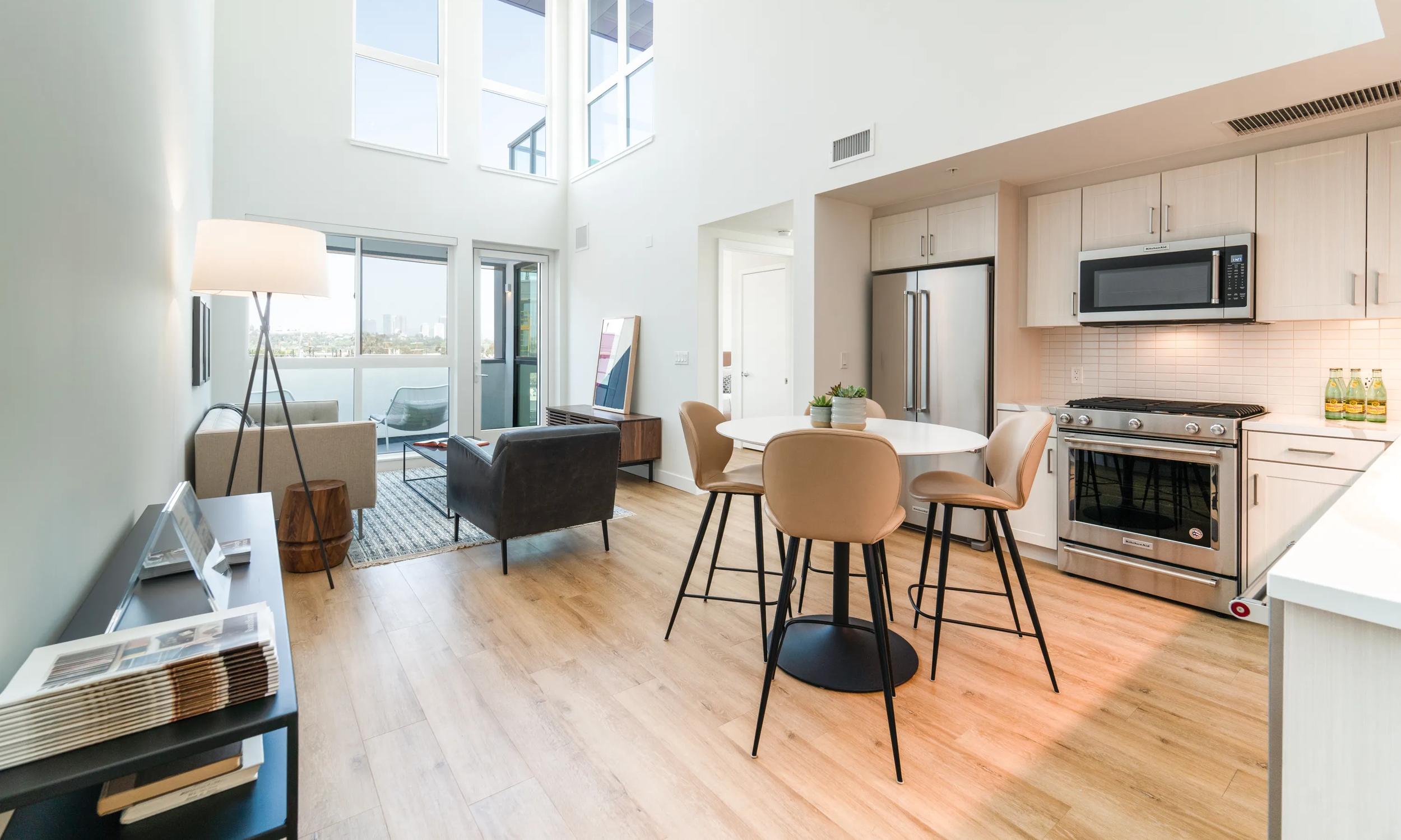 interior home with wood kitchen cabinetry and stainless steel appliances upper ivy apartments in culver city ca