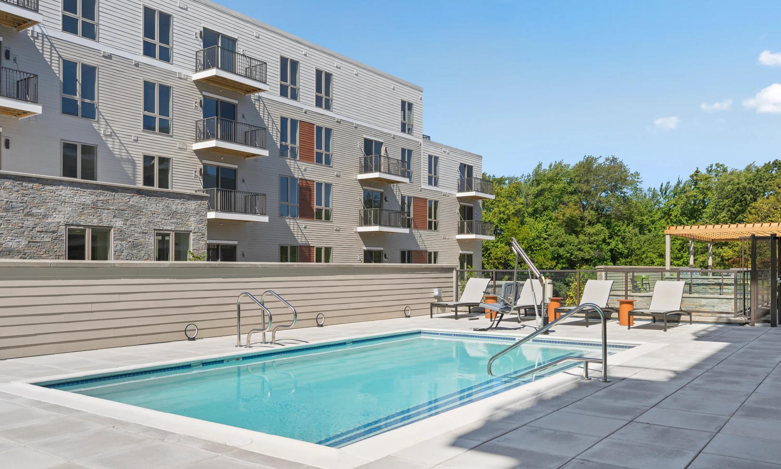 community resort inspires pool and sundeck modera newton apartments in newton ma