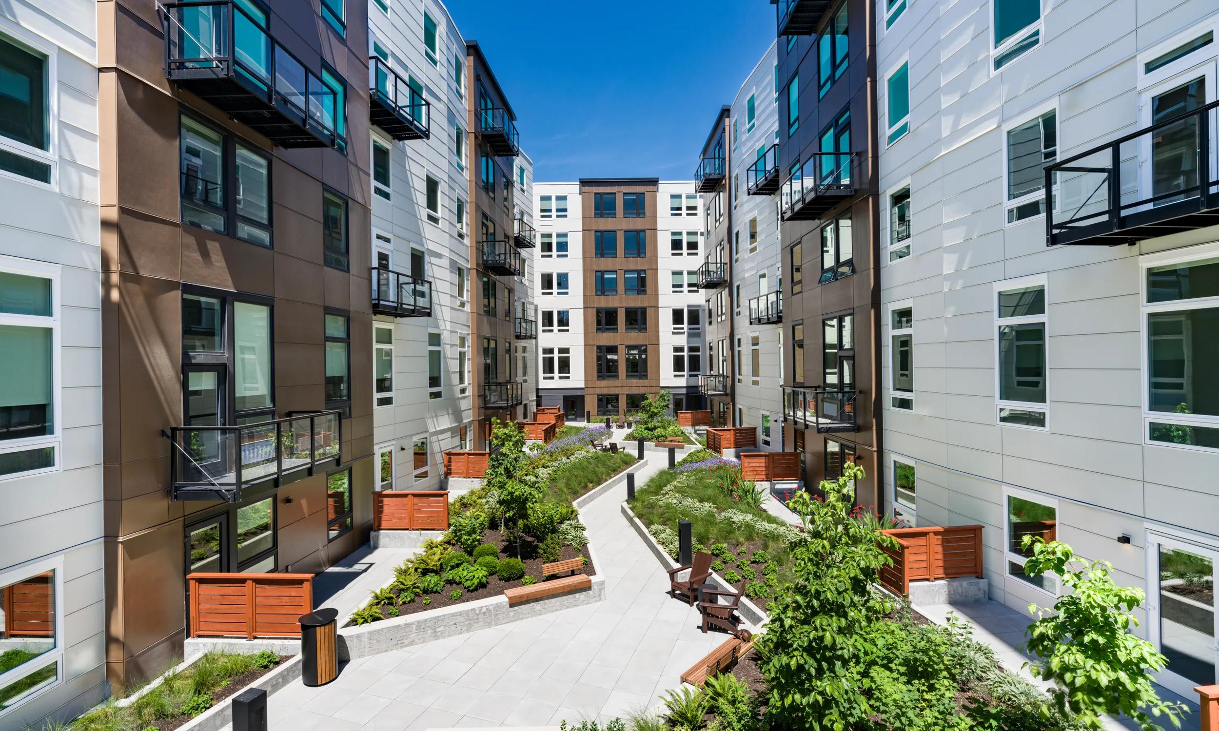 exterior with rooftop deck and grilling area modera bridle trails apartments for rent in kirkland wa