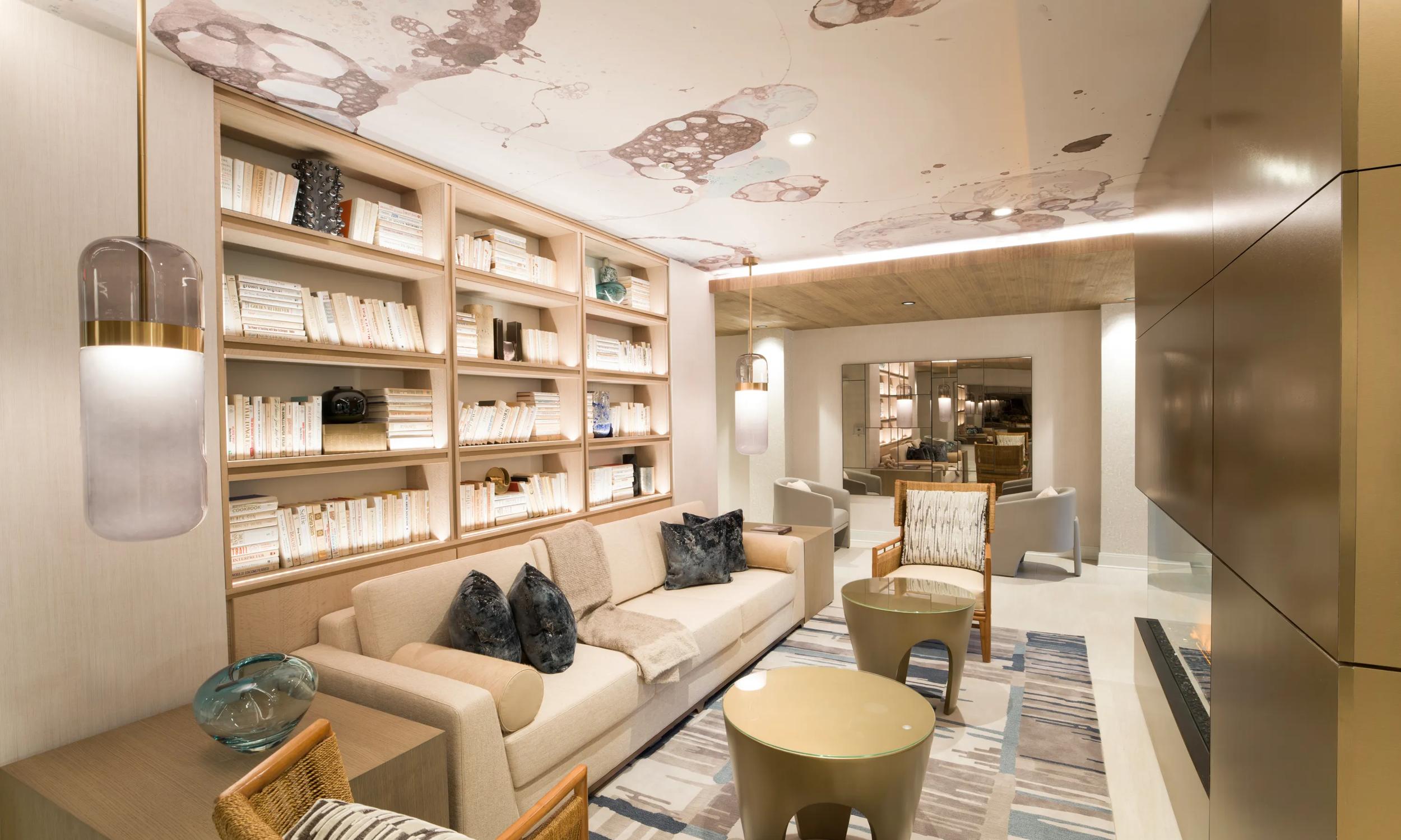 Luxurious living room with modern decor, featuring stylish woven pendant lights, elegant seating arrangement, and more modera liberty row charlotte nc apartments
