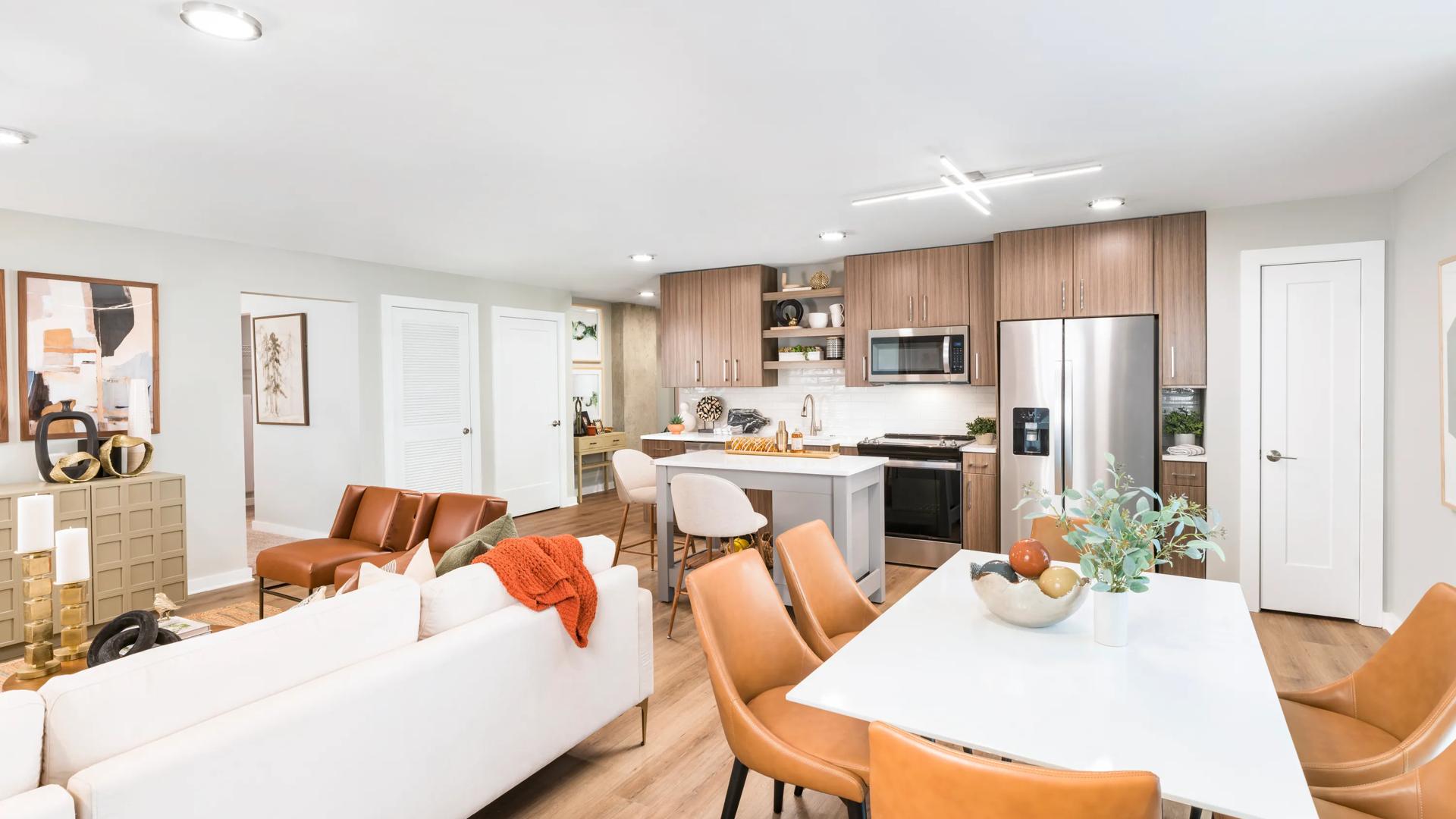 open floor plan living area with dining area and kitchen with island  modera loso apartment homes for rent in charlotte nc