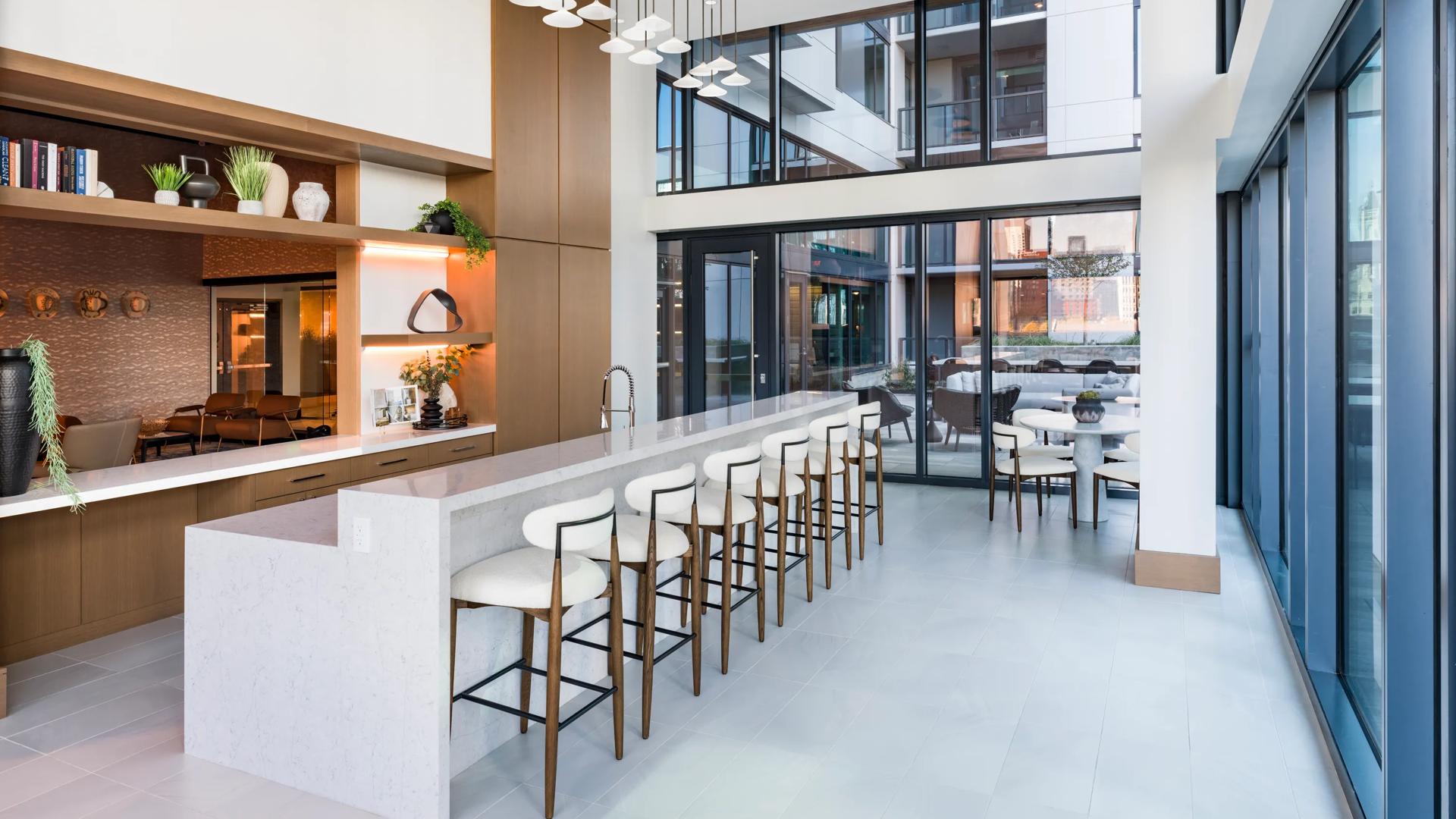 amenity space with seating and fireplace clubhouse modera mcgavock apartment homes for rent in nashville tn