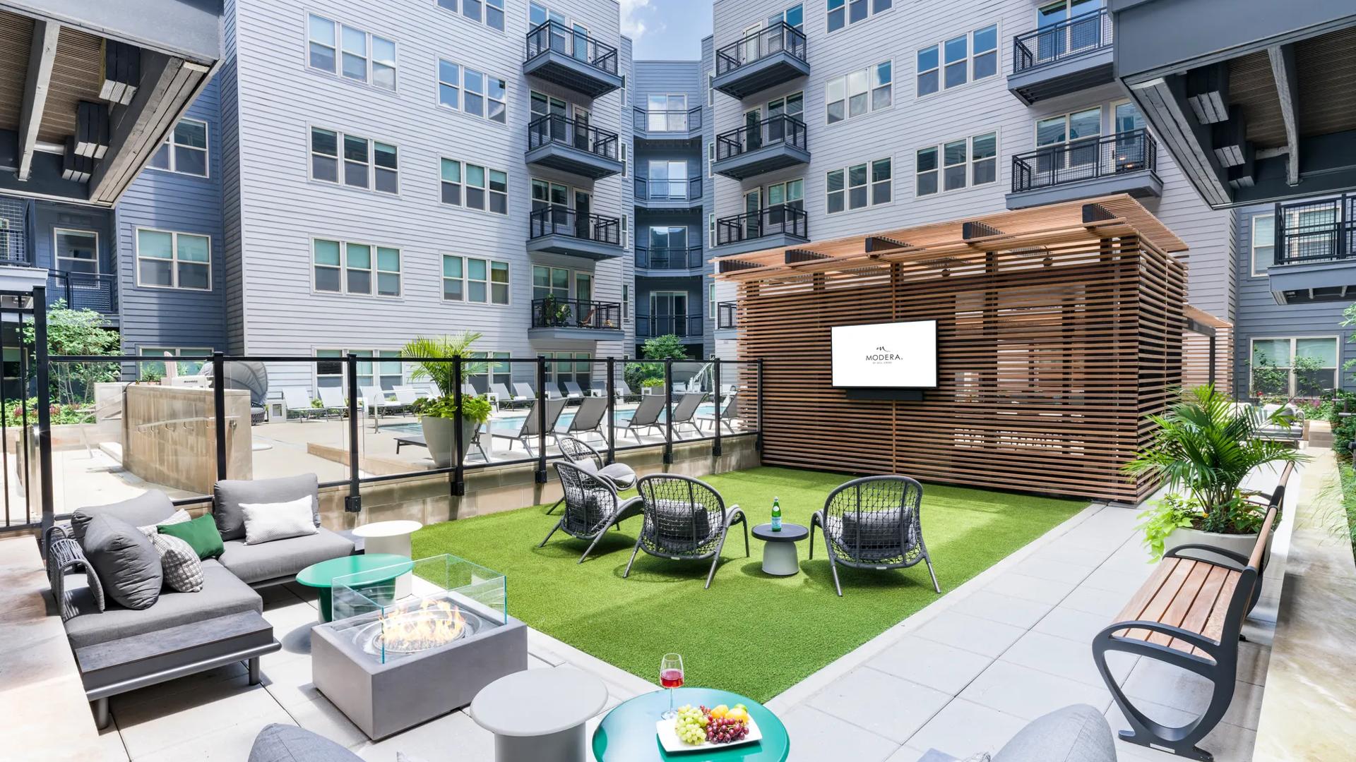 community courtyard with pool, grilling, and outdoor lounge seating