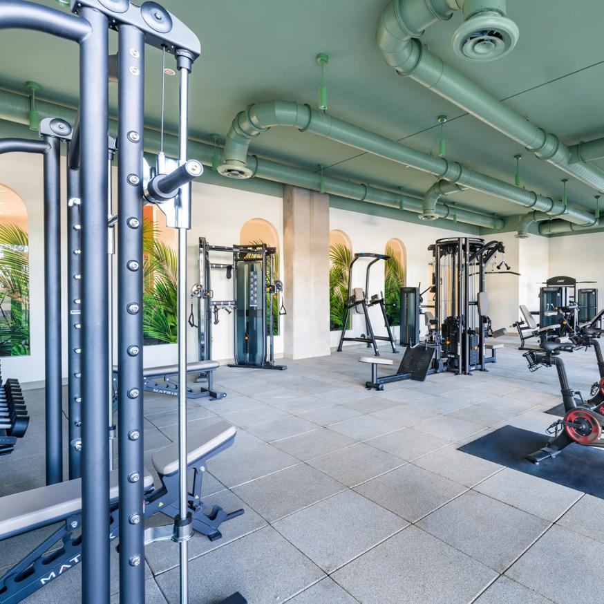 woman stretching in gym modera academical village apartment homes for rent in davie fl
