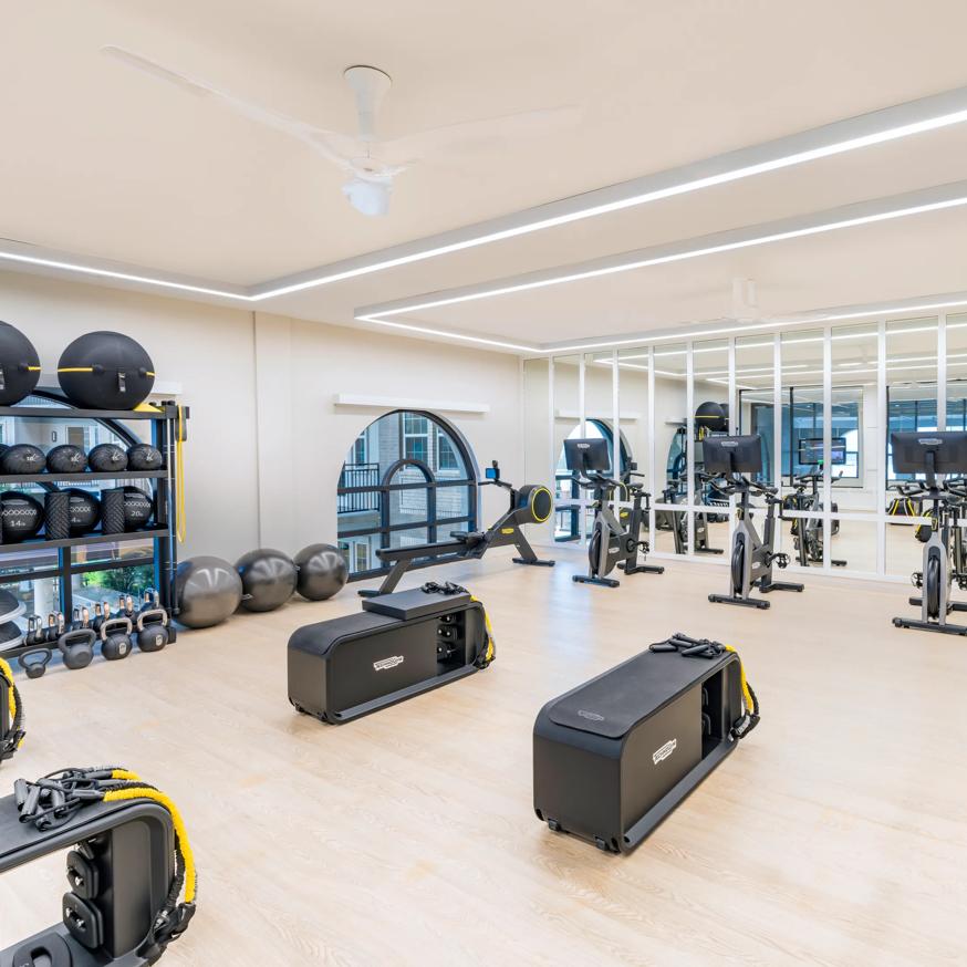 person running on treadmill in gym modera waugh apartment homes for rent in houston texas