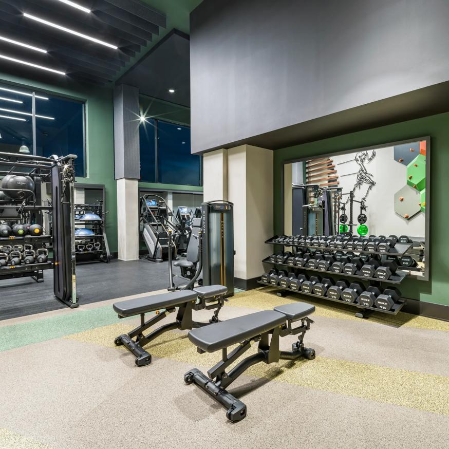 man running on treadmill in gym modera h street apartment homes for rent in washington dc
