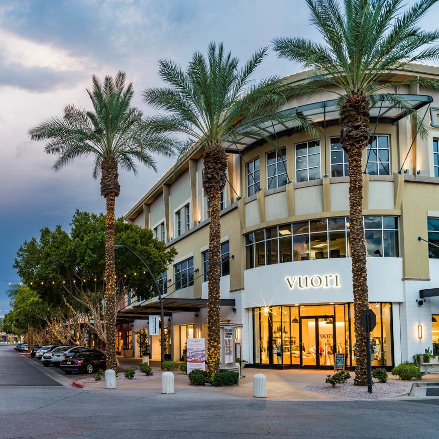 exterior of retail lined street with vuori store modera kierland apartment homes for rent in scottsdale az
