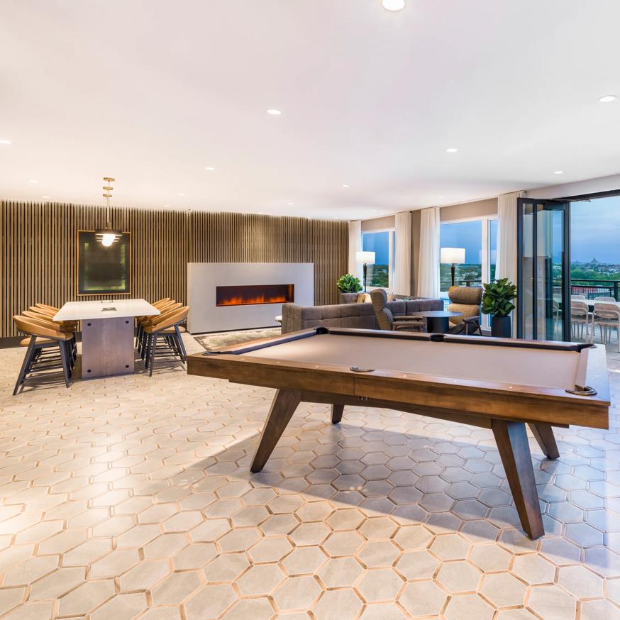 rooftop deck with billiards table and large windows with fireplace modera h street apartment homes for rent in washington dc