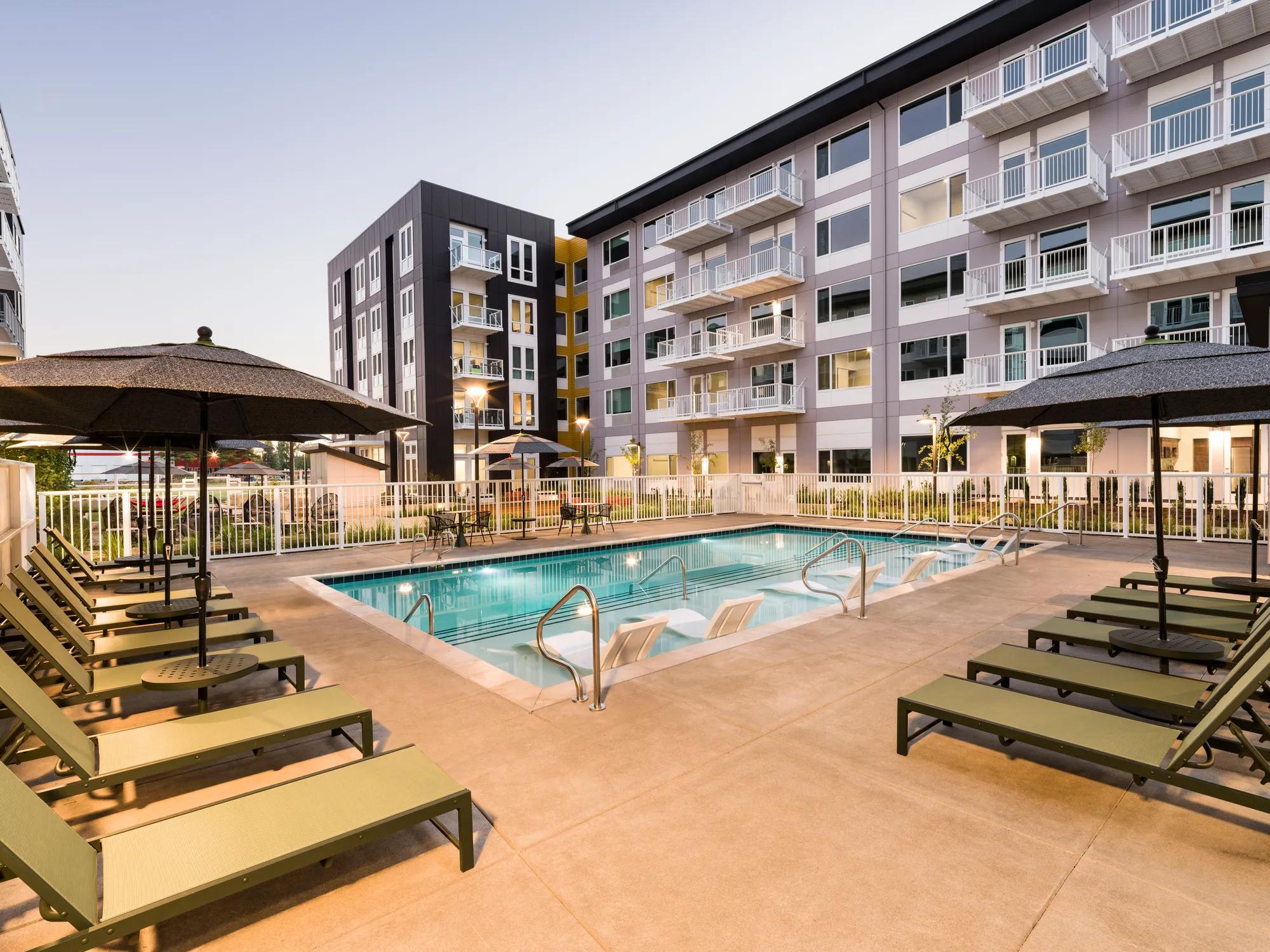 pool area and outdoor deck at modera raleigh hills apartment homes for rent in beaverton or