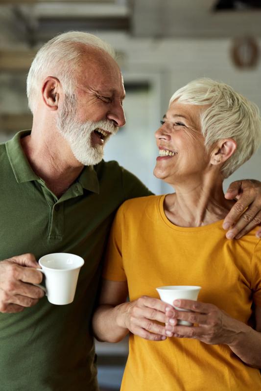 mature couple sipping their morning coffee