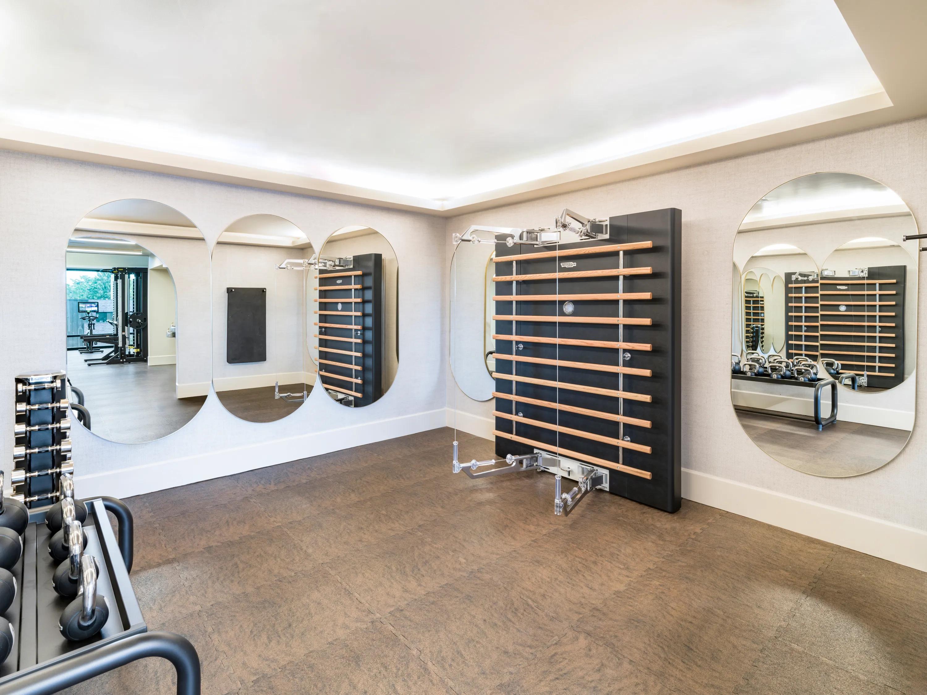 yoga room with mats on floor at modera university park apartment homes for rent in denver co