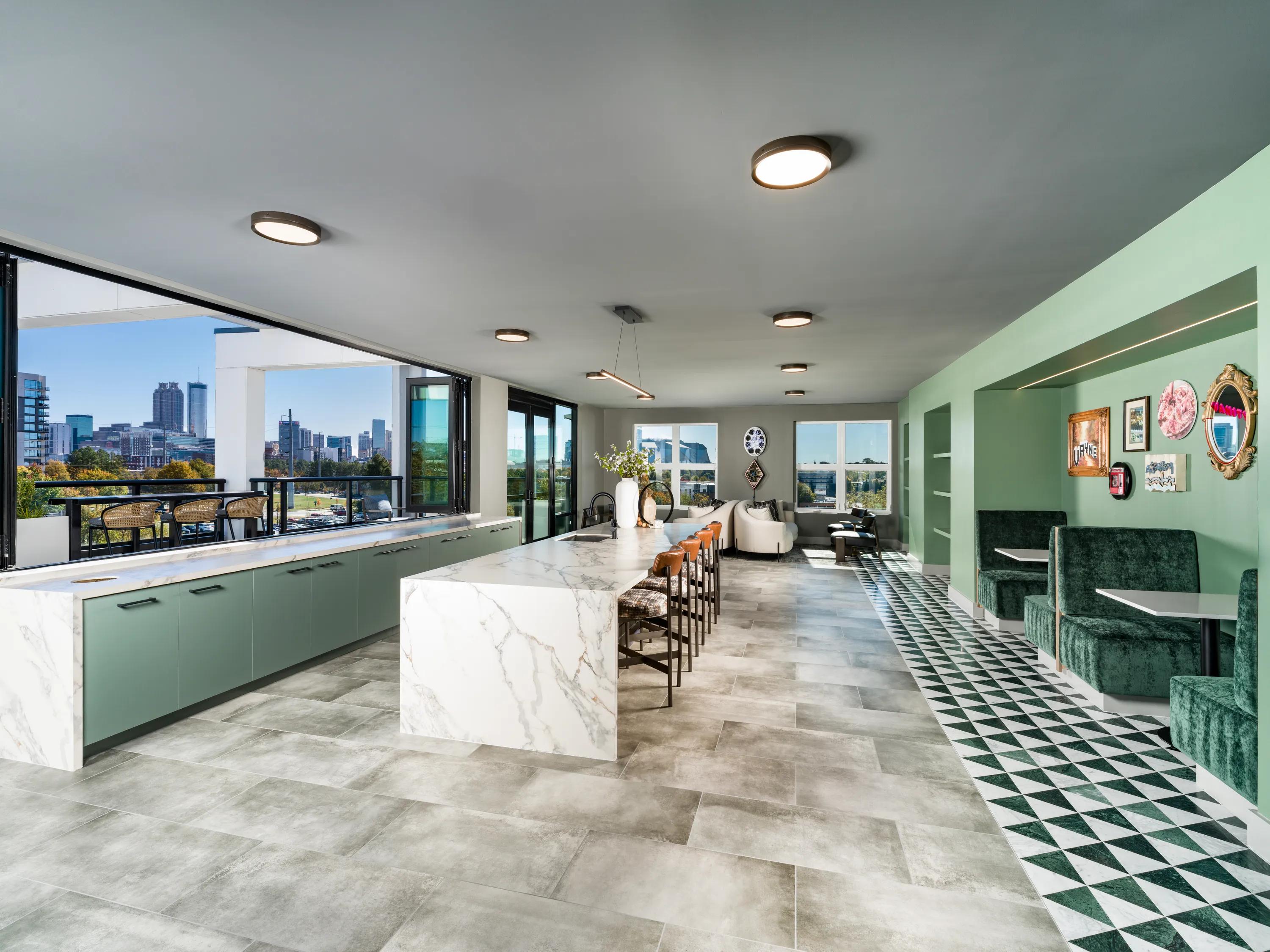 8th-floor sky lounge with bar area and outdoor deck with sweeping views