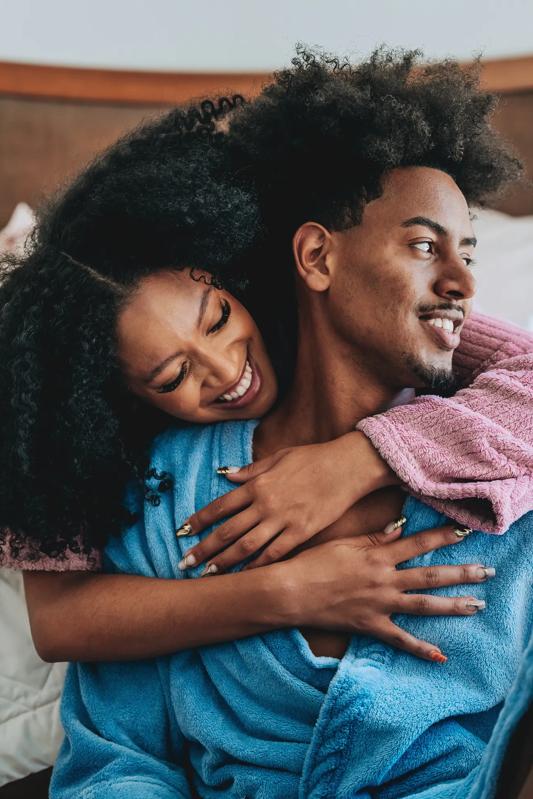 Woman hugging man from behind