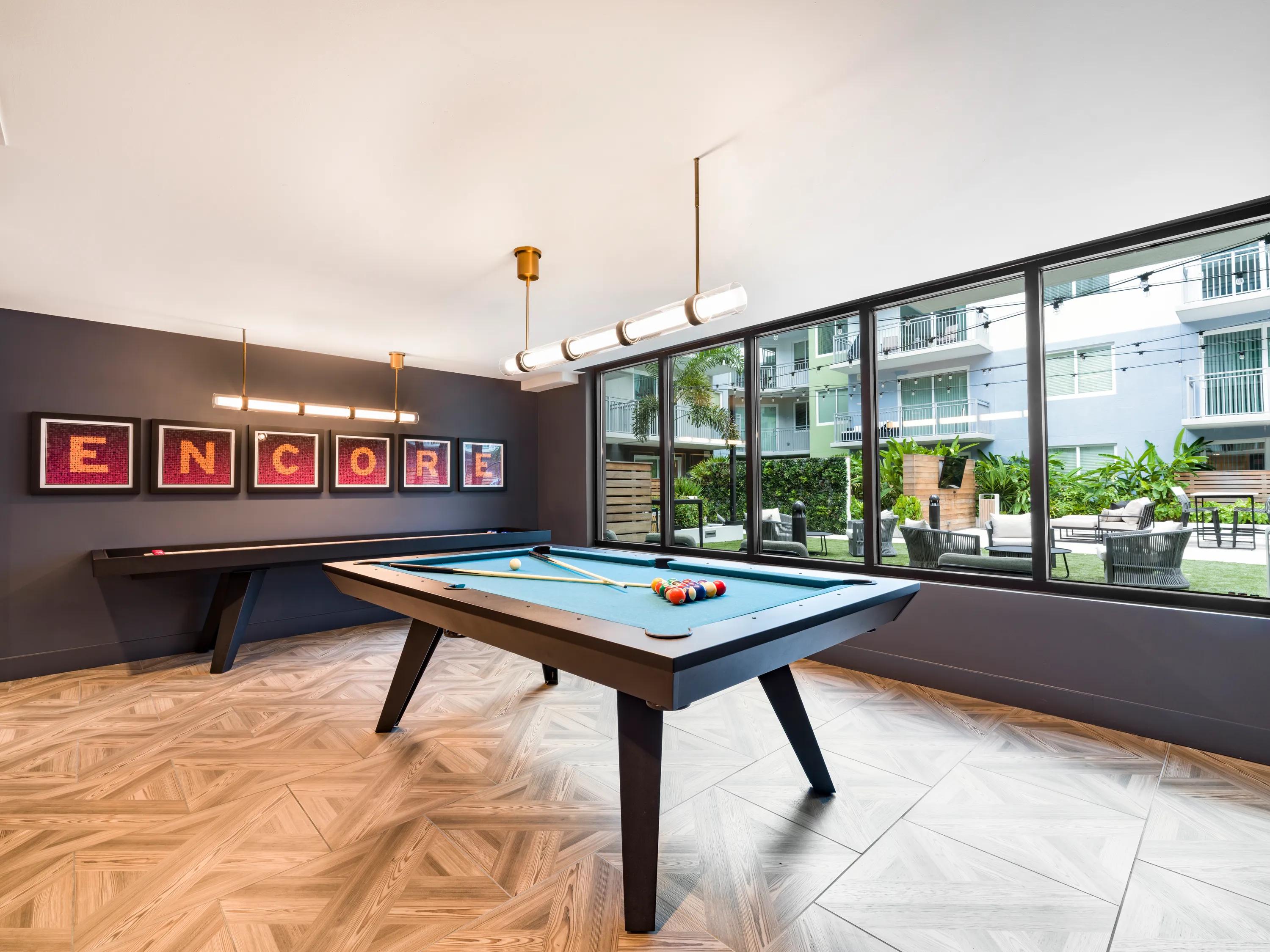 Game room with billiards and lounge seating