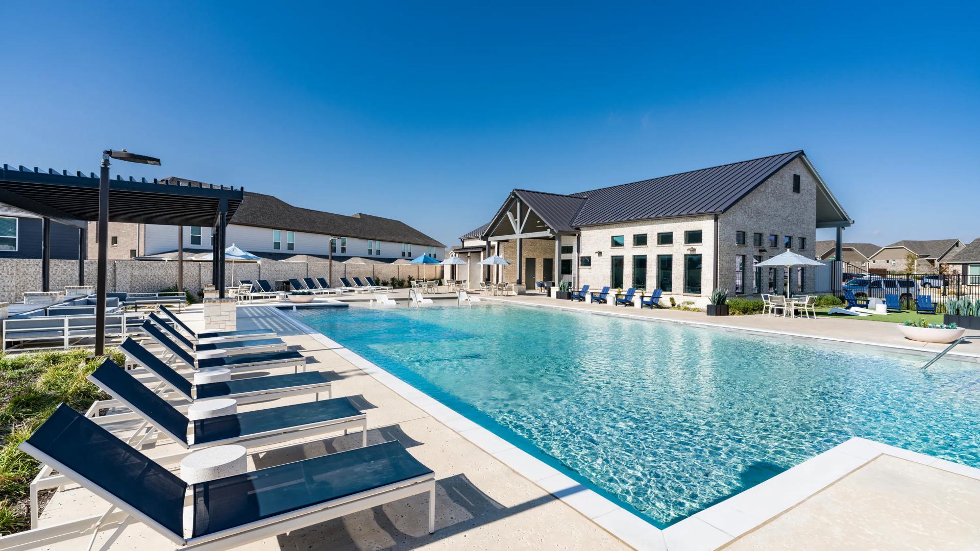 pool with sundeck and in-pool seating amavi celina homes for rent